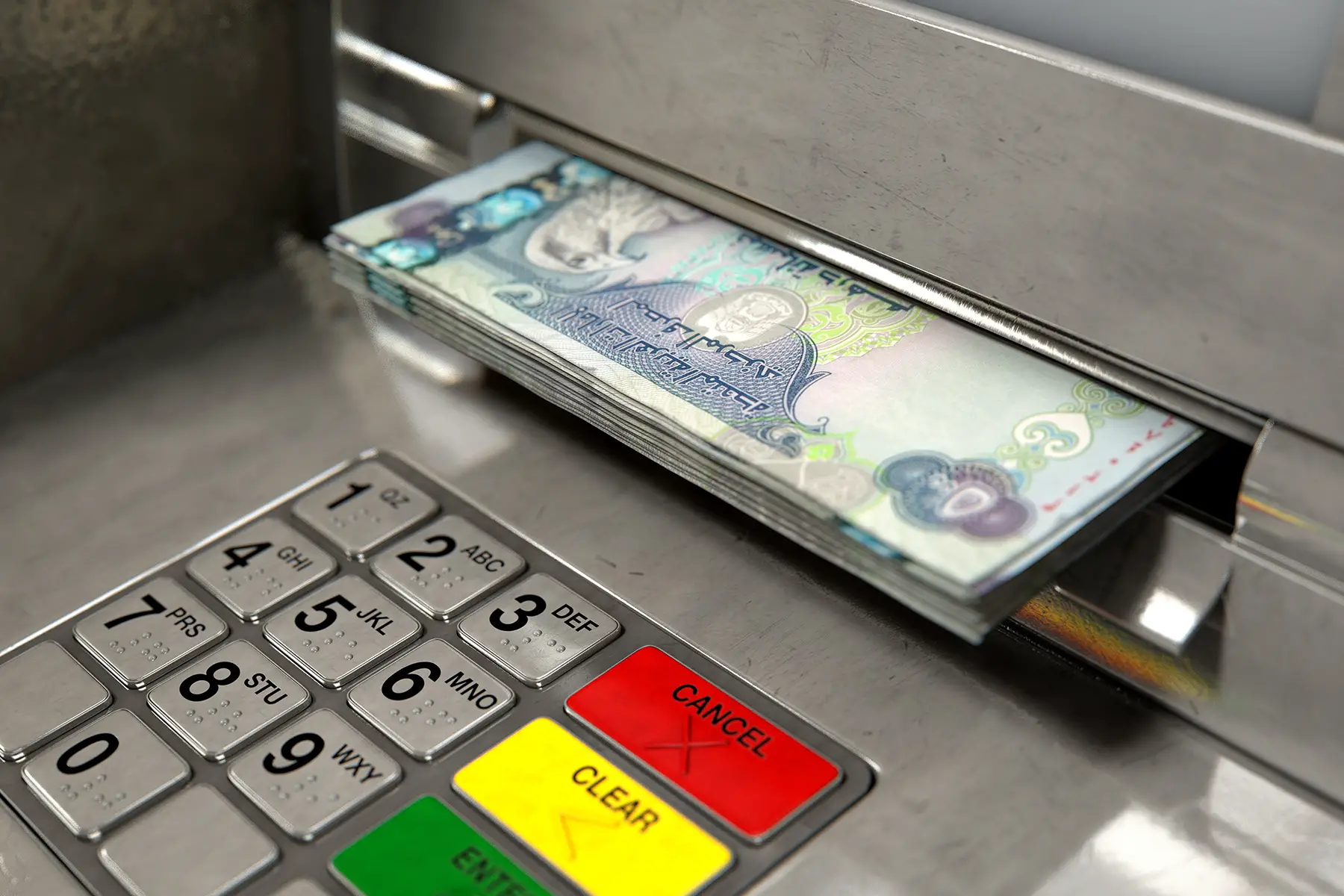 ATM dispensing Emirati dirham notes