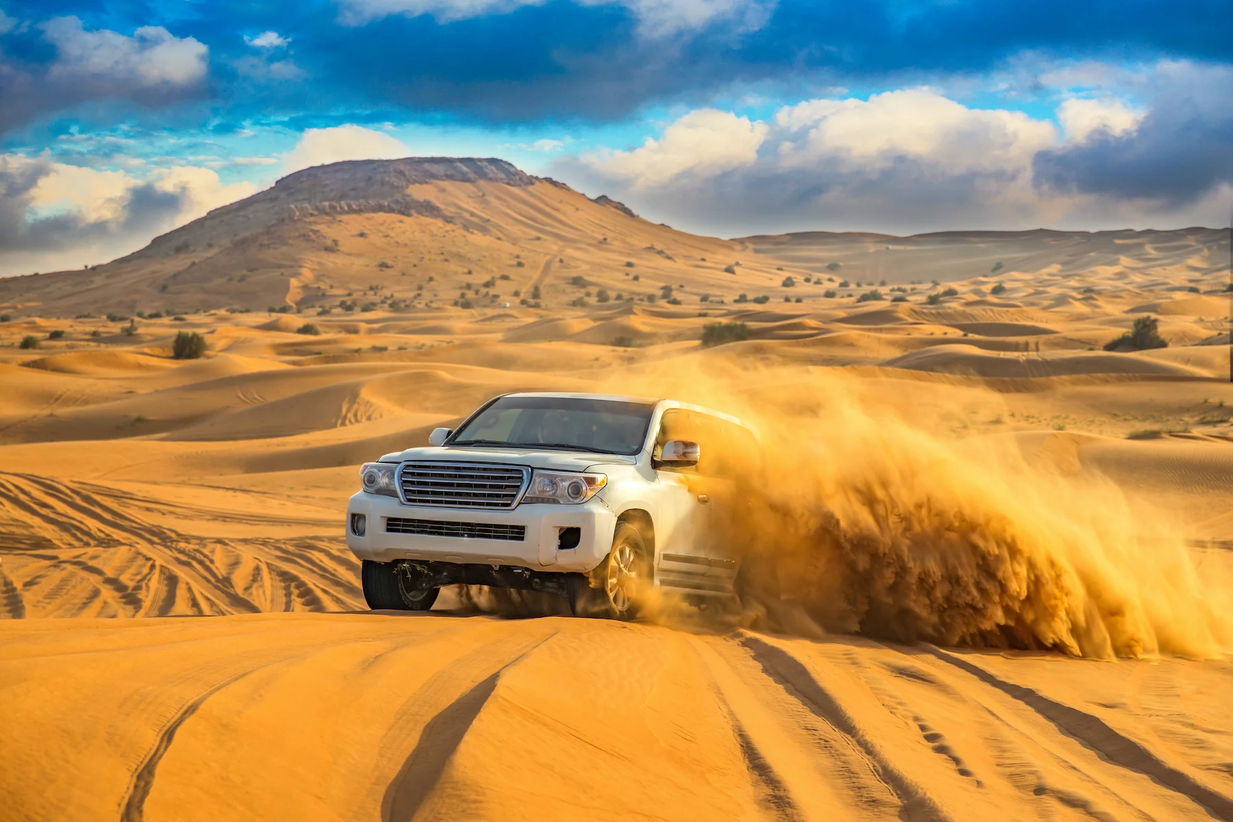 A car dune bashing in the desert