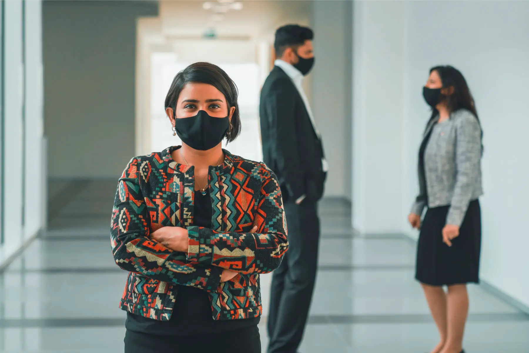 colleagues wear masks as part of UAE coronavirus measures