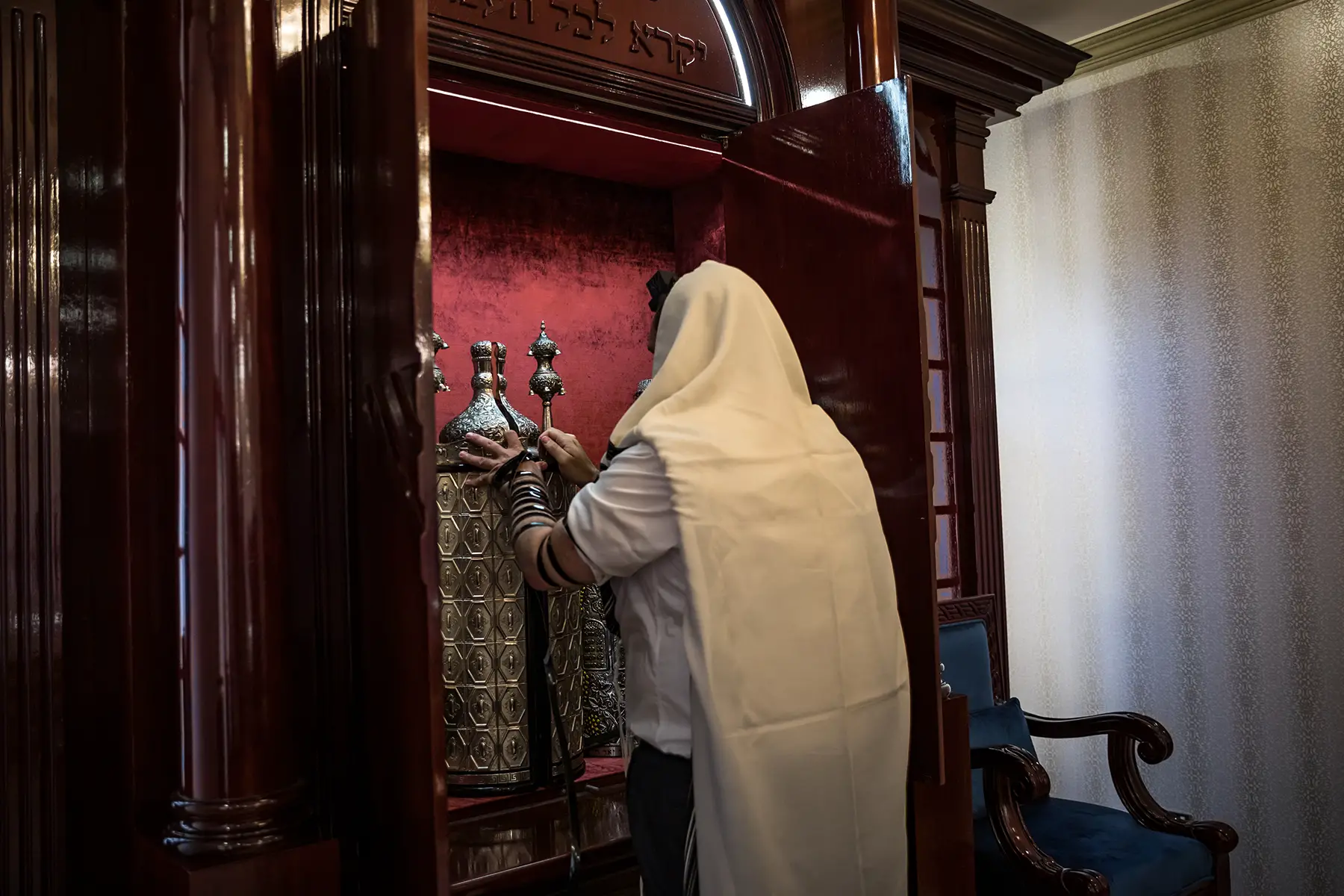 A Rabbi rolling the Torah in a synagogue in Dubai