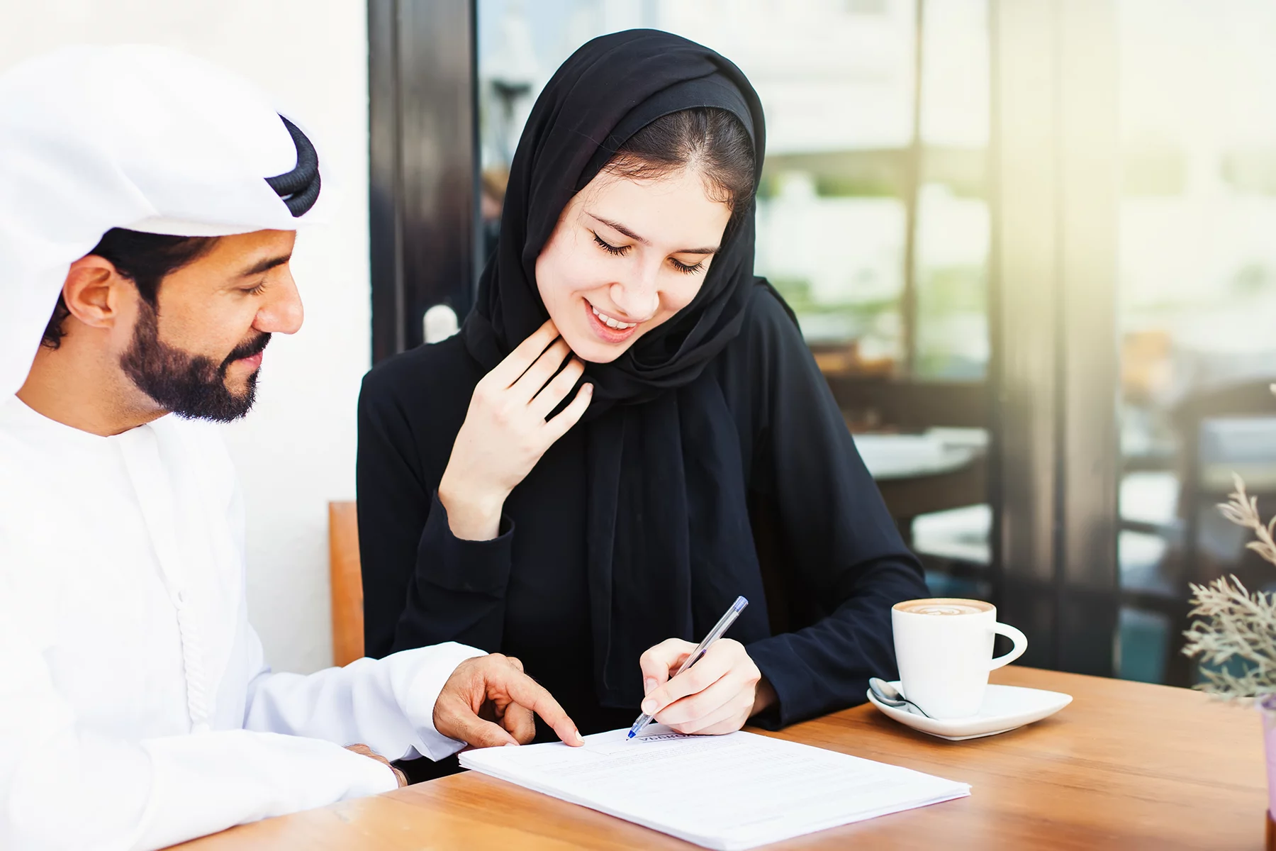Emirati woman signing contract