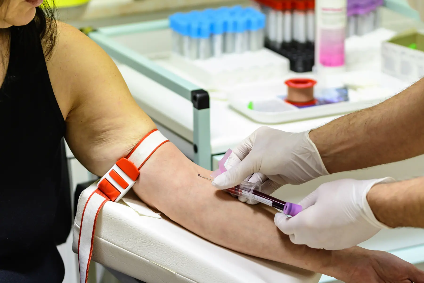 a close up of blood being drawn for hiv testing
