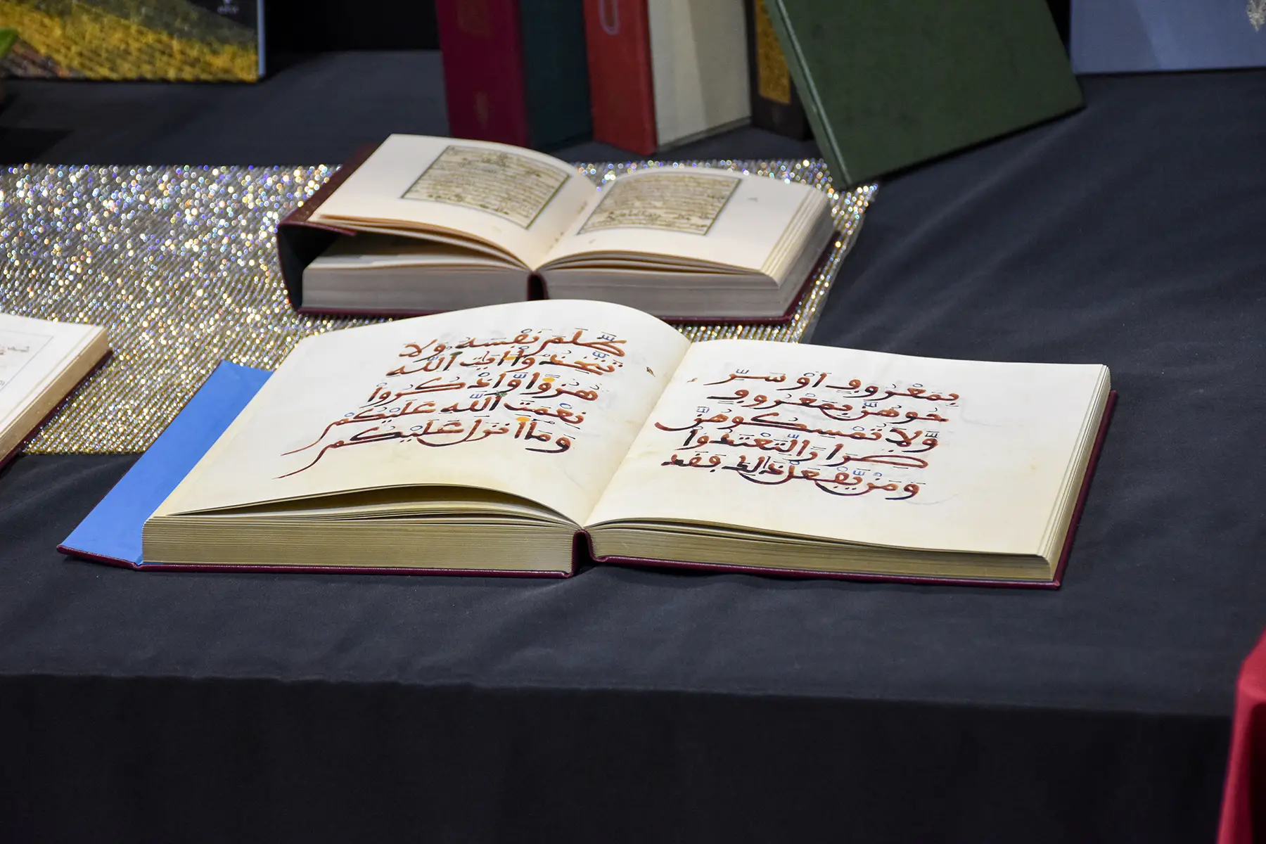 Old Arabic books open on a table
