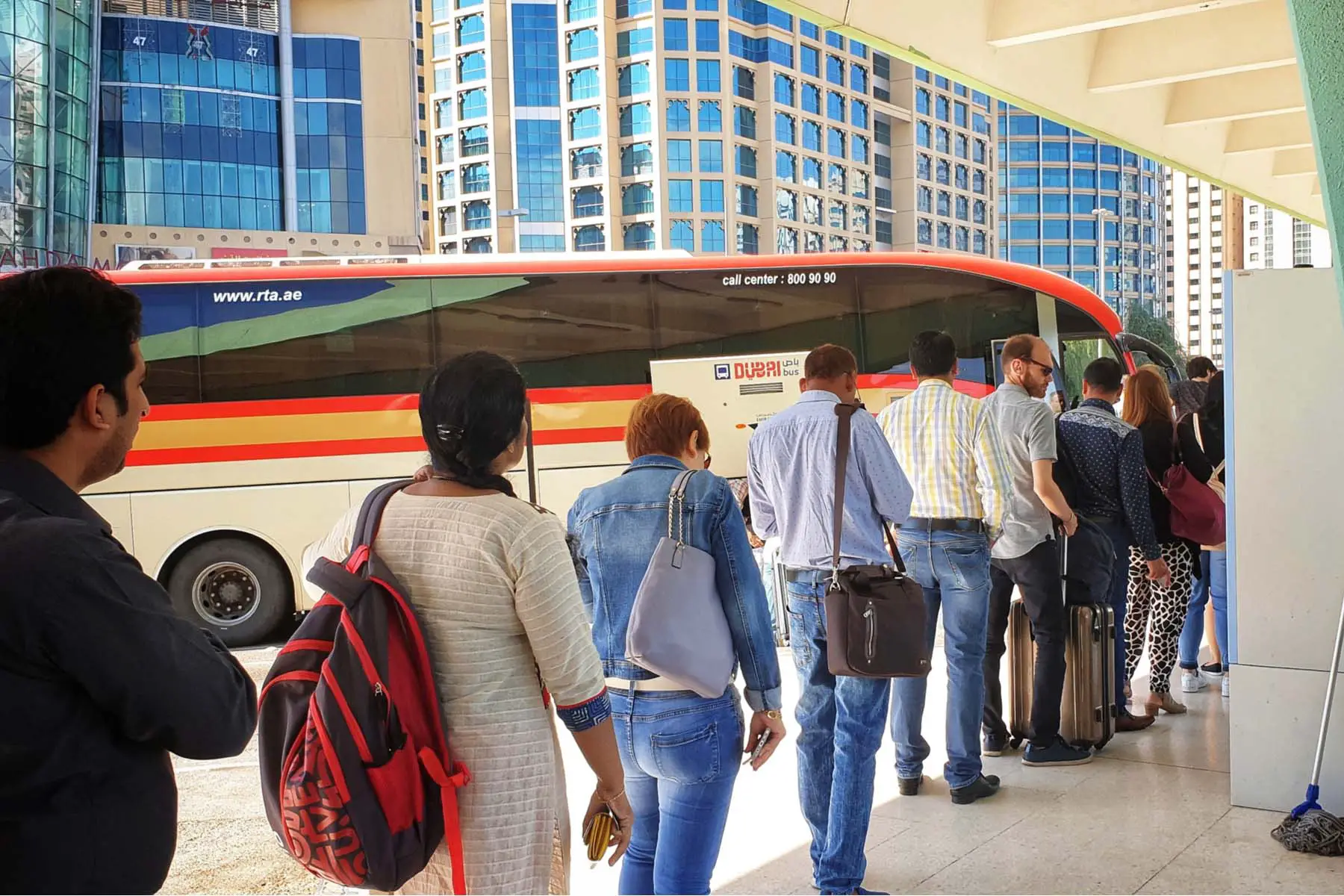 people queuing for a bus in Abu Dhabi