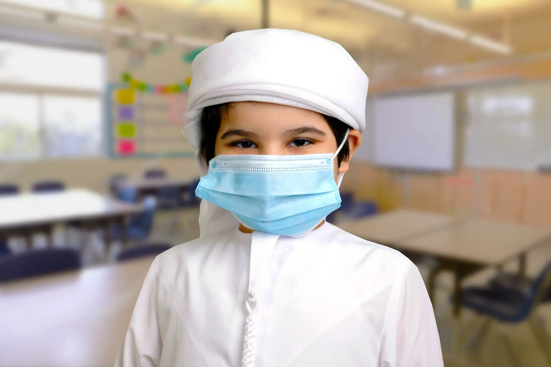 a UAE pupil where's a mask in class due to coronavirus