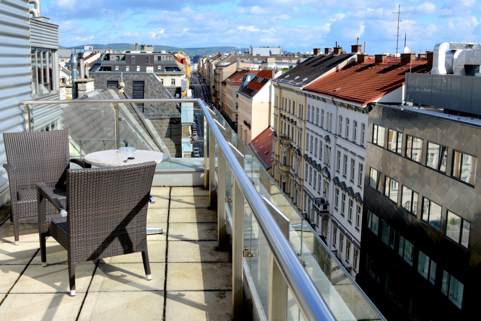 Rooftops of Vienna buildings shown from the balcony of an apartment