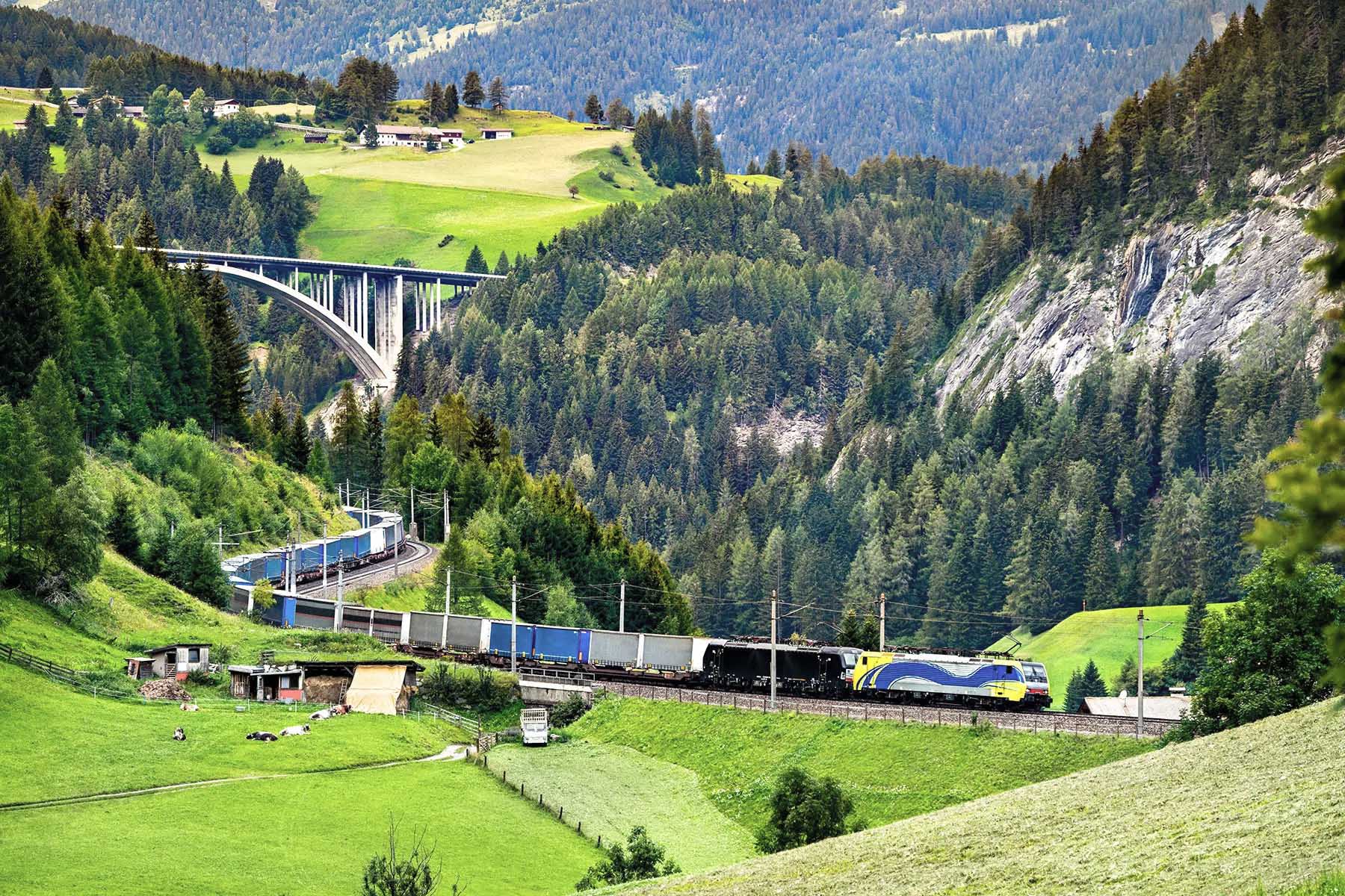 A rail freight train crosses the Alps in Austria