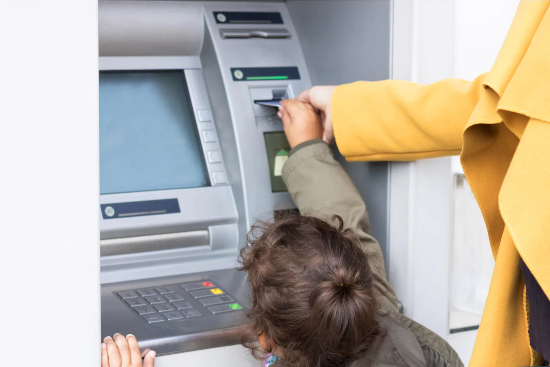 Child using ATM