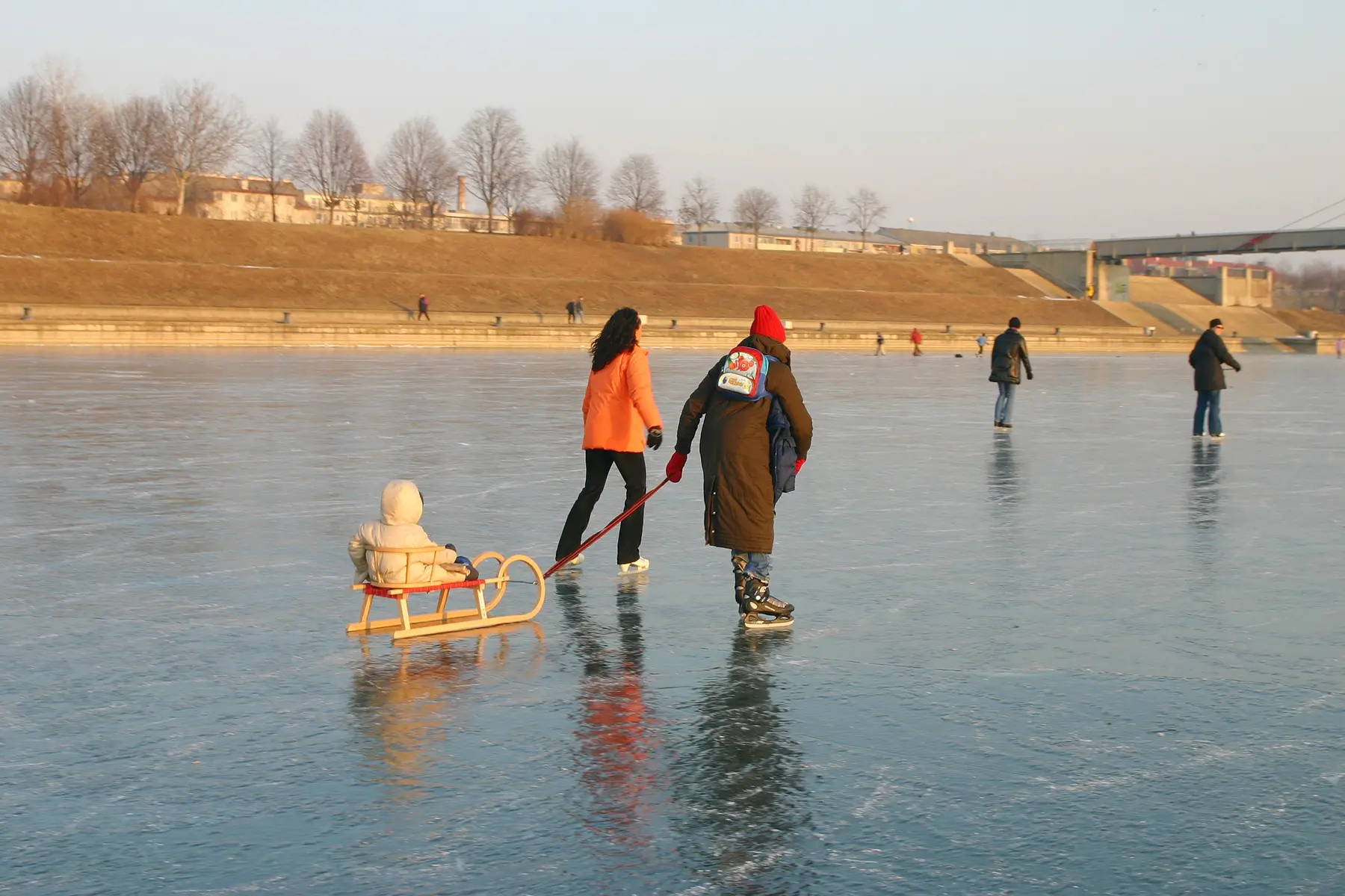 Family skating on the frozen Donau in Vienna