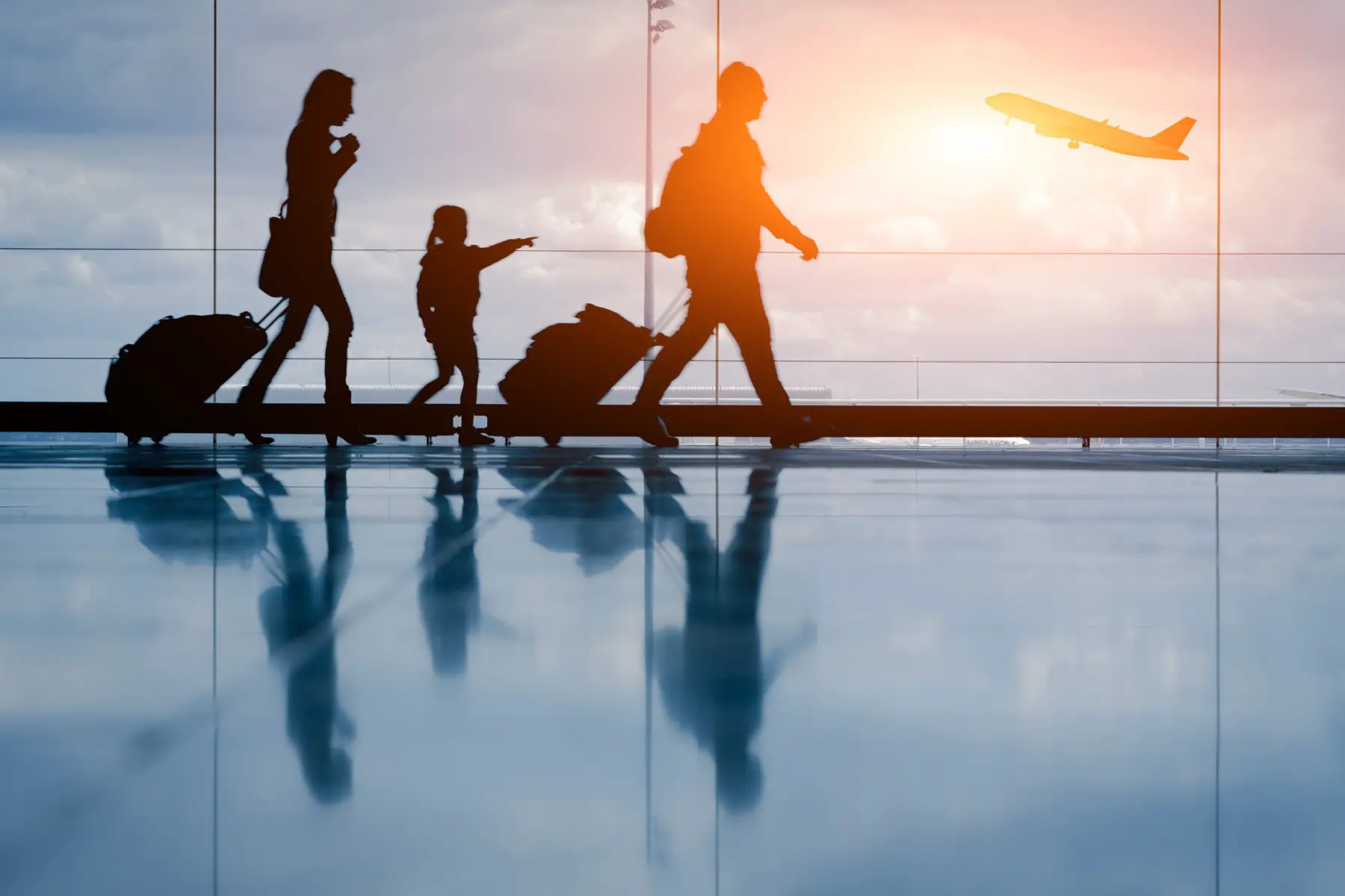 Family walking through an airport