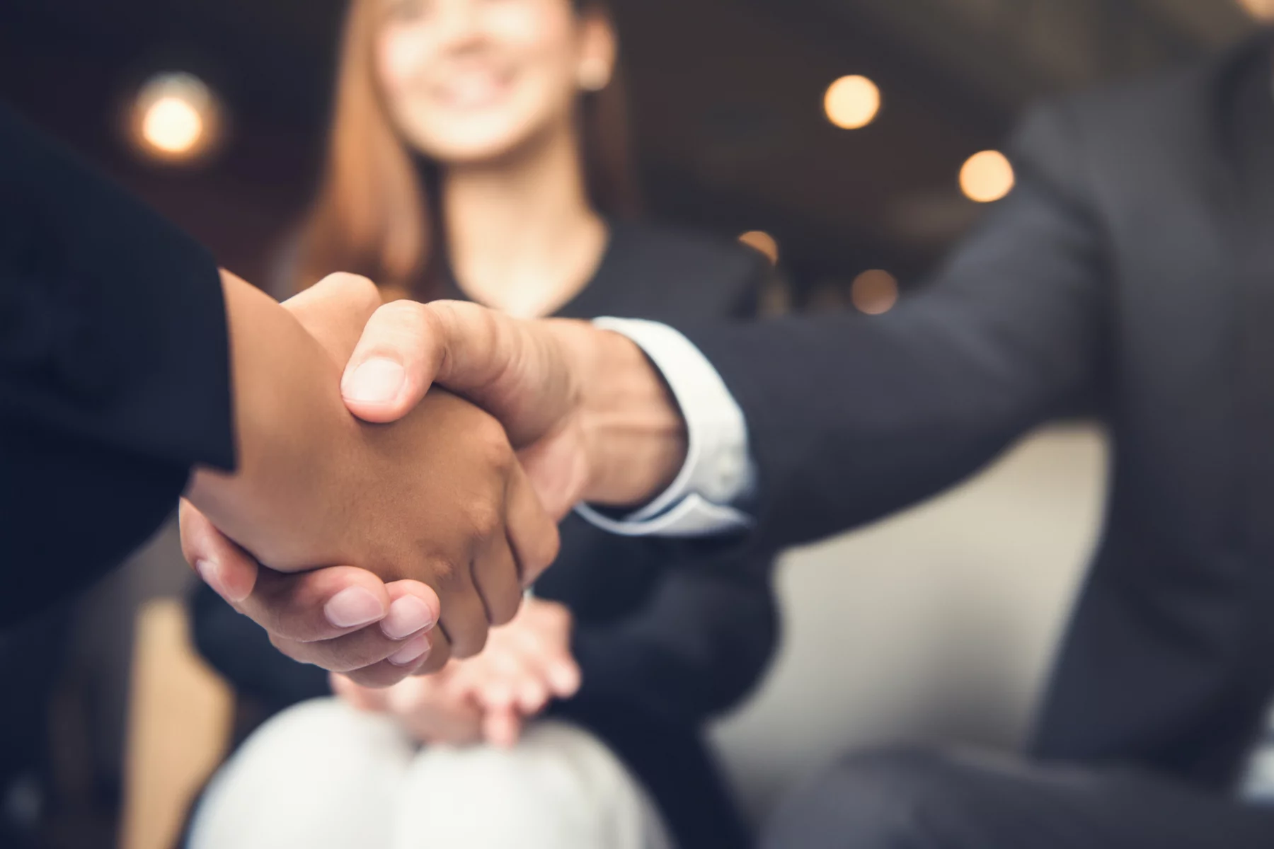 Handshake after a company merger