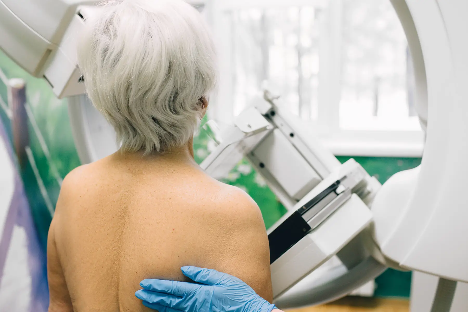 a woman having a mammogram scan at a hospital