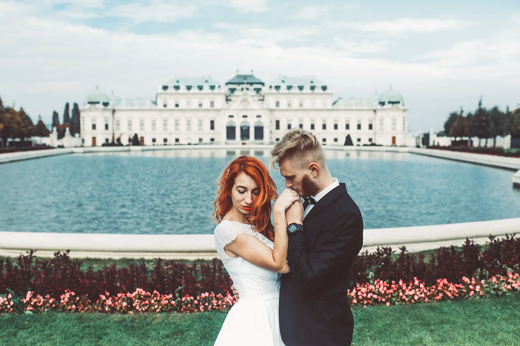 Married couple in front of the Belvedere Palace in Vienna