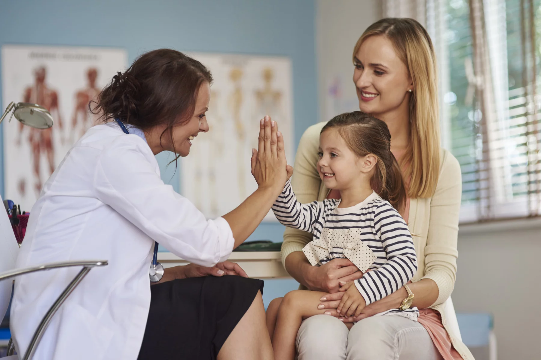 Mother and child visiting doctor
