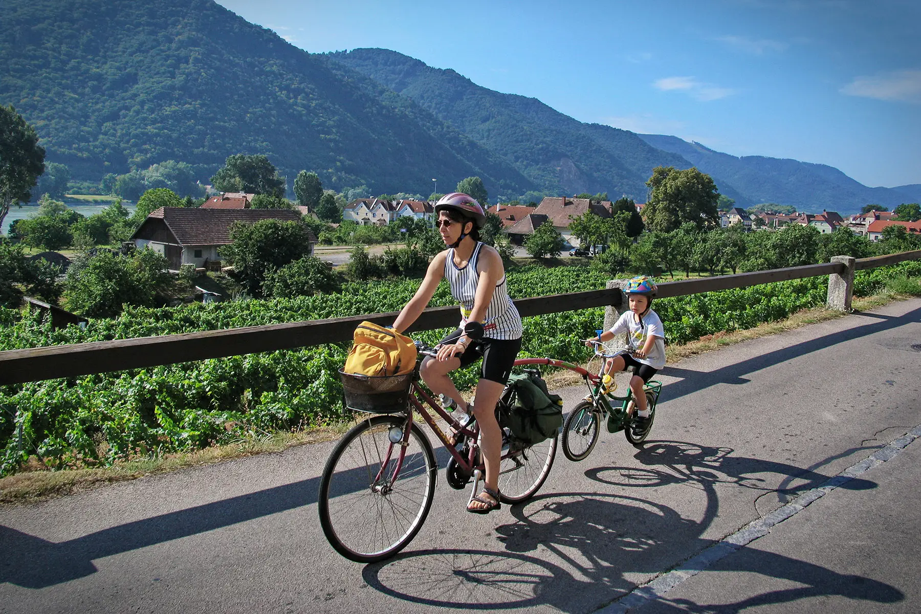 Mother and son cycling in rural Austria