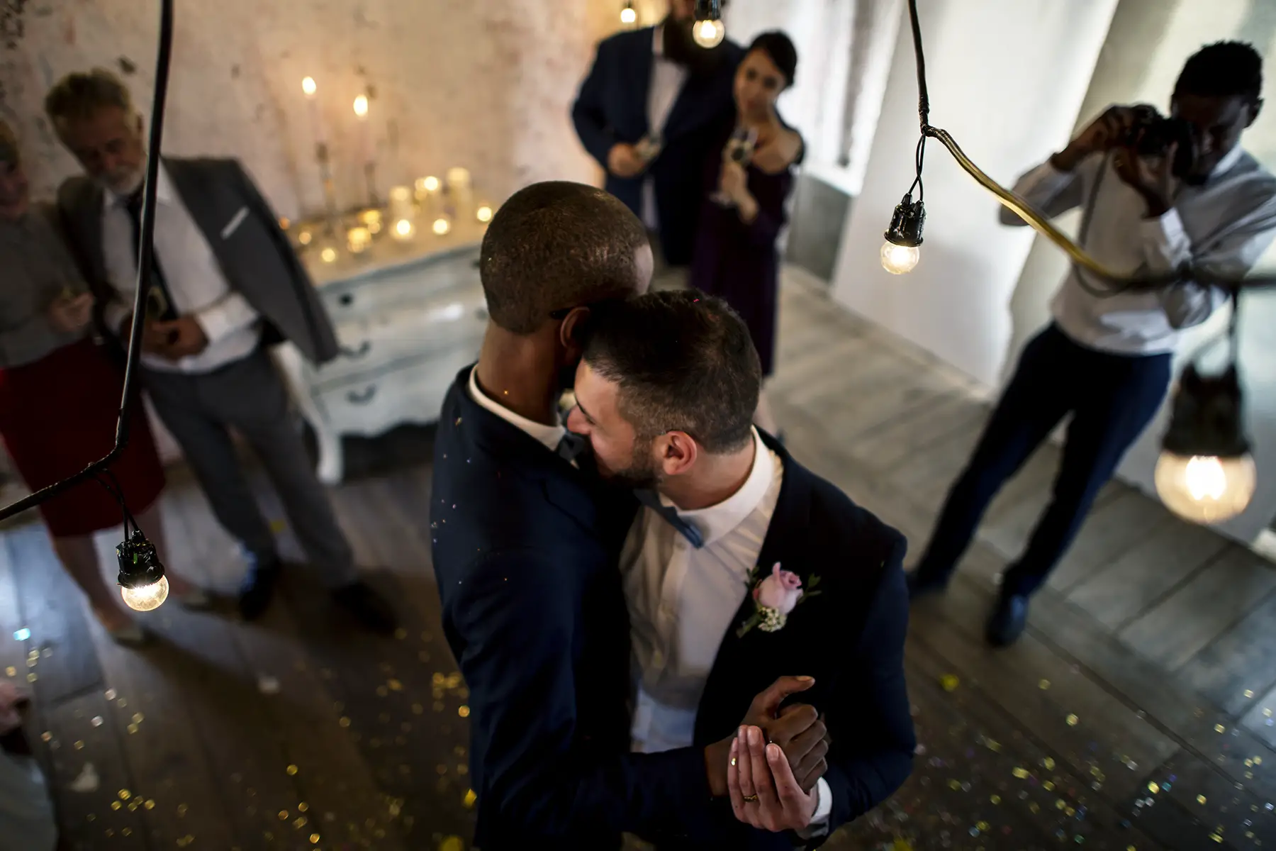 Newlywed gay couple dancing at their wedding