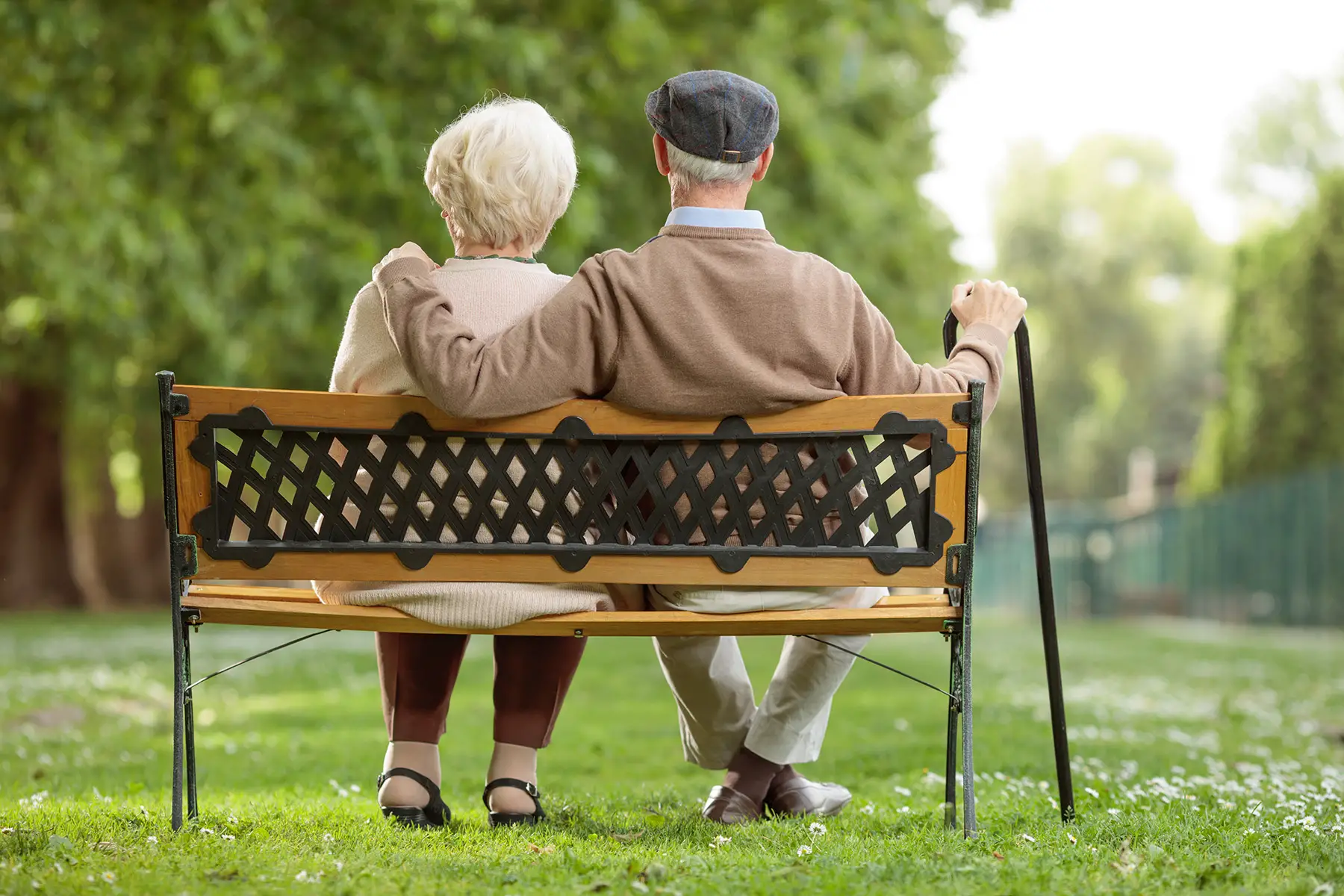 Retired couple sitting on a bench