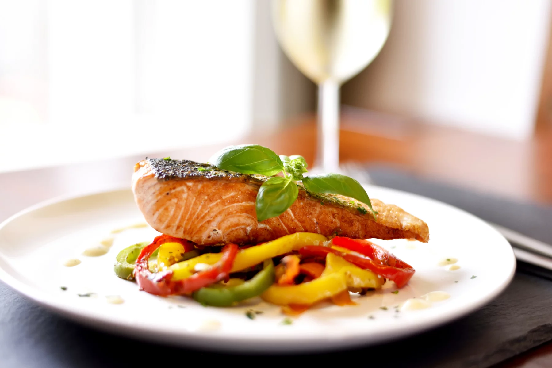 Salmon dinner with a glass of white wine