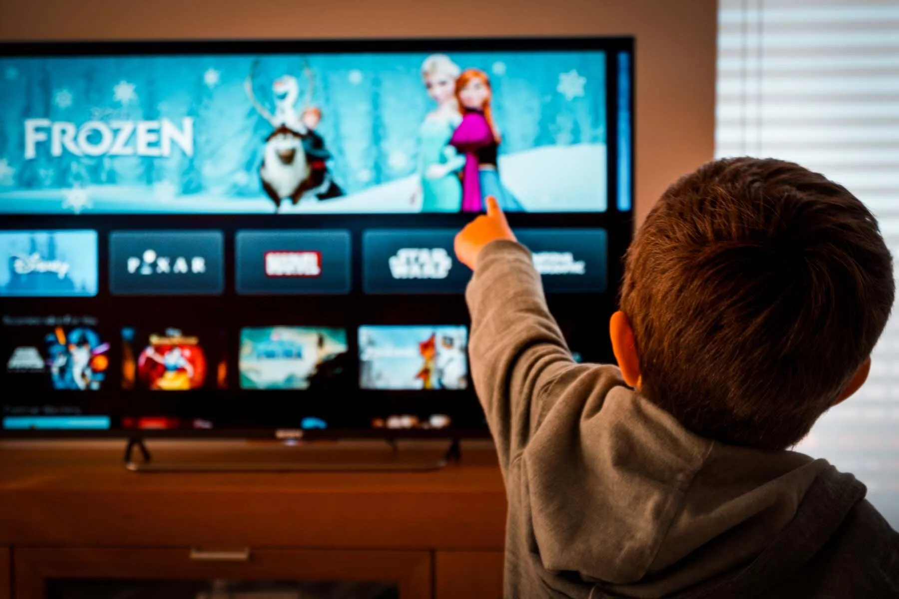 Child watching Frozen on TV in Austria