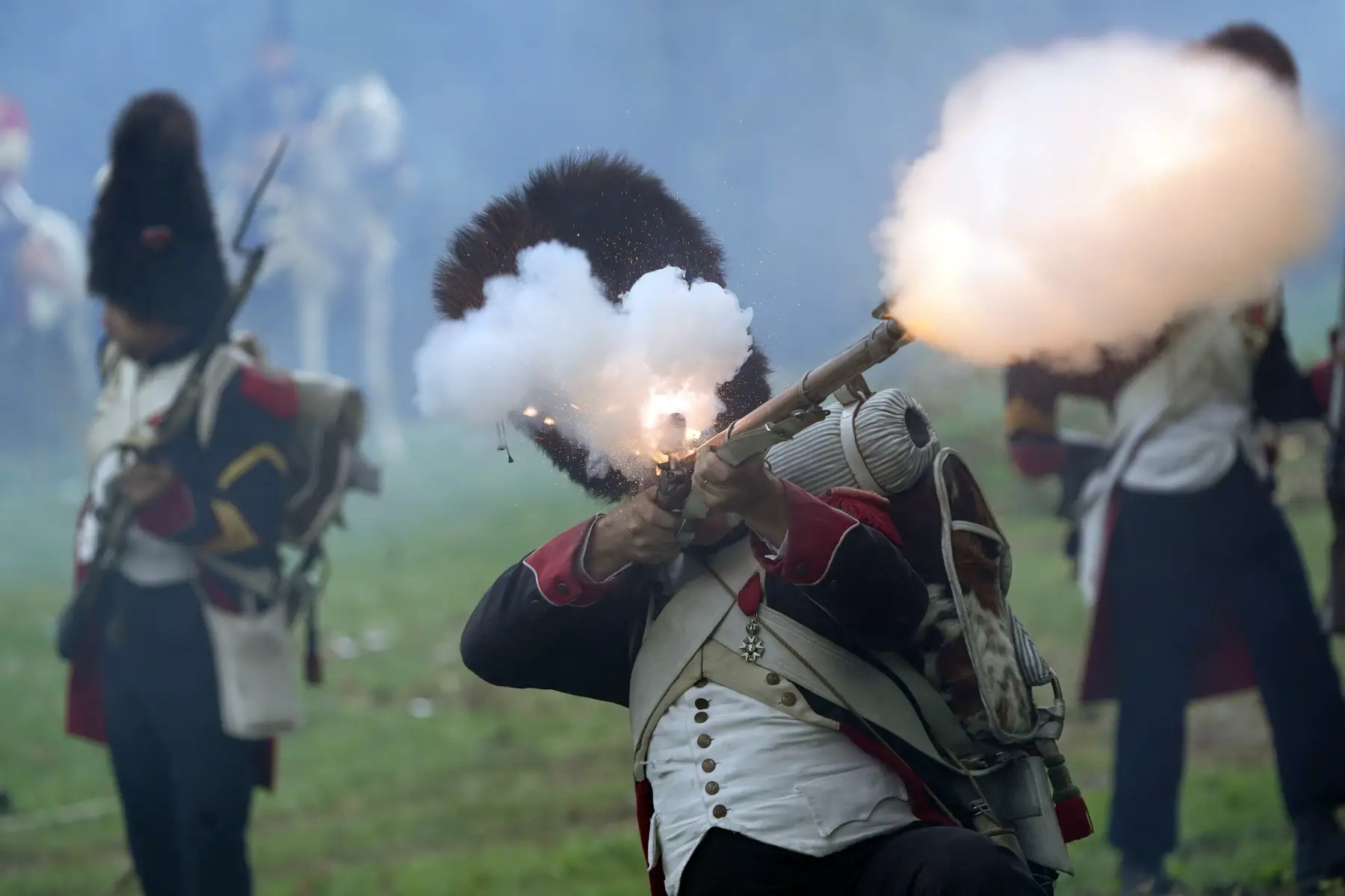 an actor dressed as a soldier and firing a gun during the Battle Of Waterloo Reenactment in 2023 