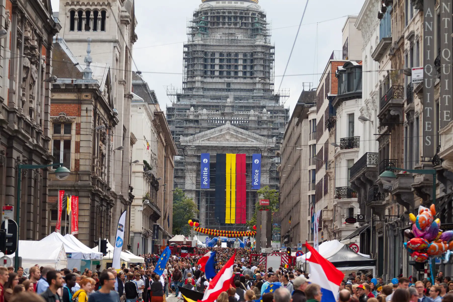 People celebrating Belgian independence during National Day at Rue de la Regence in Brussels.