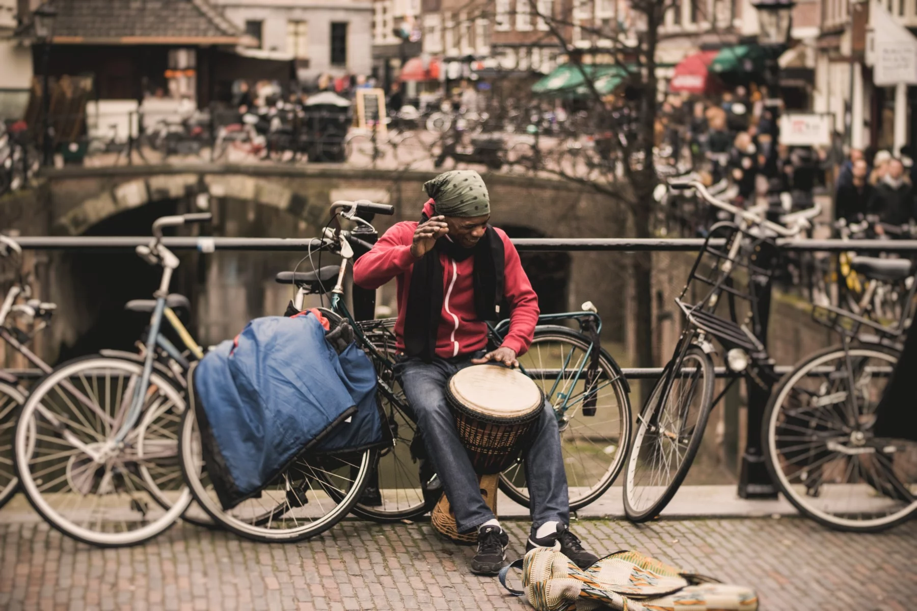 Belgian busker drumming in Amsterdam, the Netherlands.