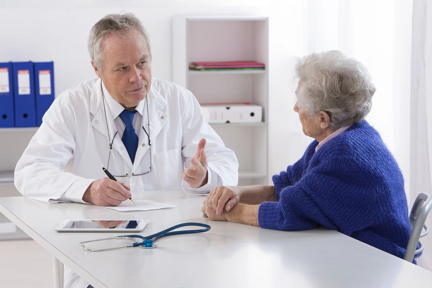 Doctor speaking with an elderly patient