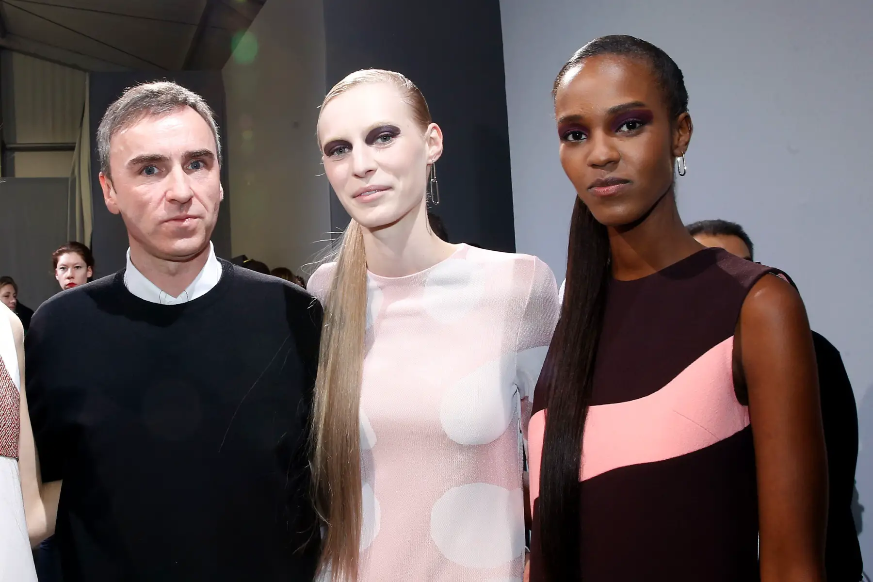 designer Raf Simons and his models pose backstage after the Christian Dior show during Paris Fashion Week in March 2015