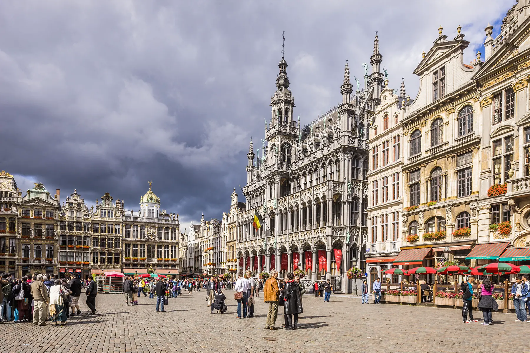 The Grand Place with the historical buildings and the elaborately decorated 17th-century guildhalls (or guild houses) of the Grand Place like Le Pigeon, Le Marchand d'or and the King's House or Breadhouse
