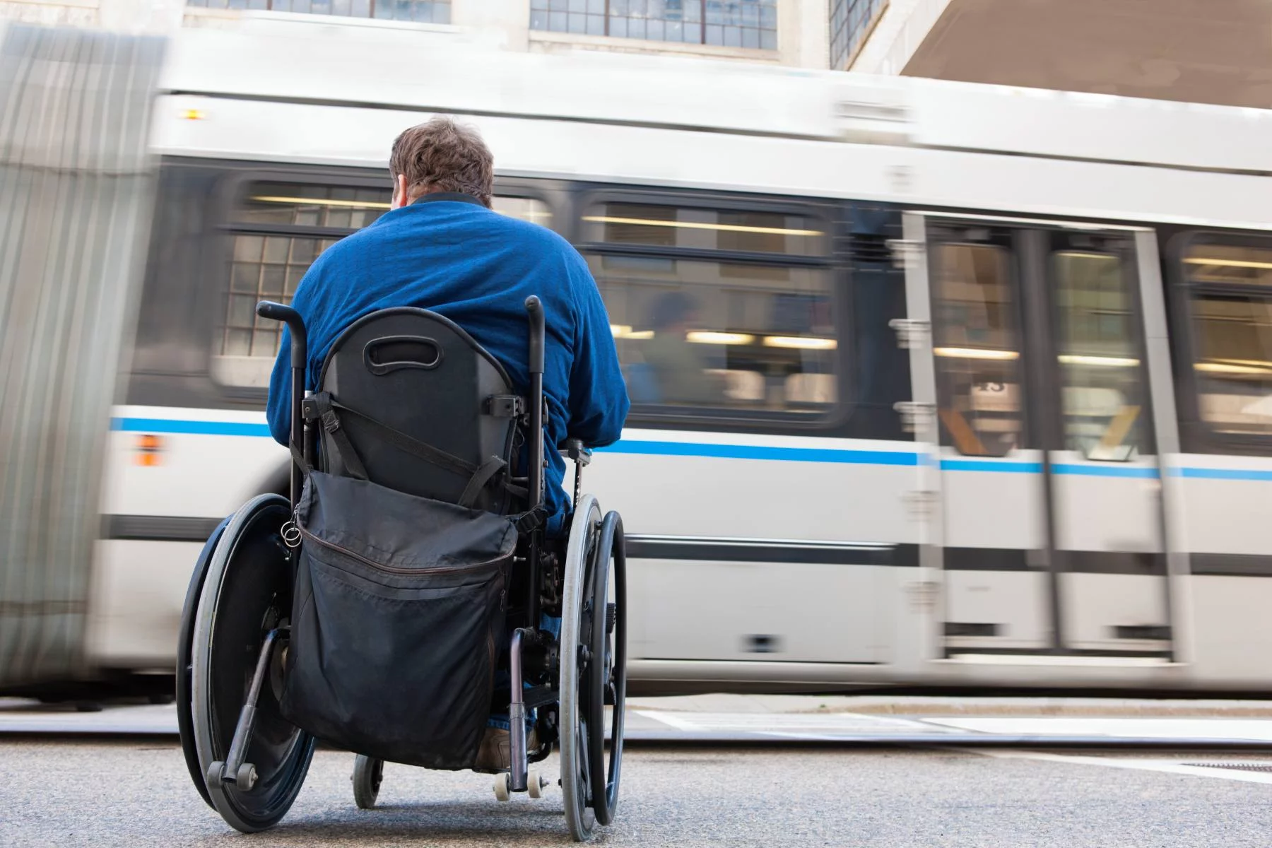 Wheelchair user waiting for a train