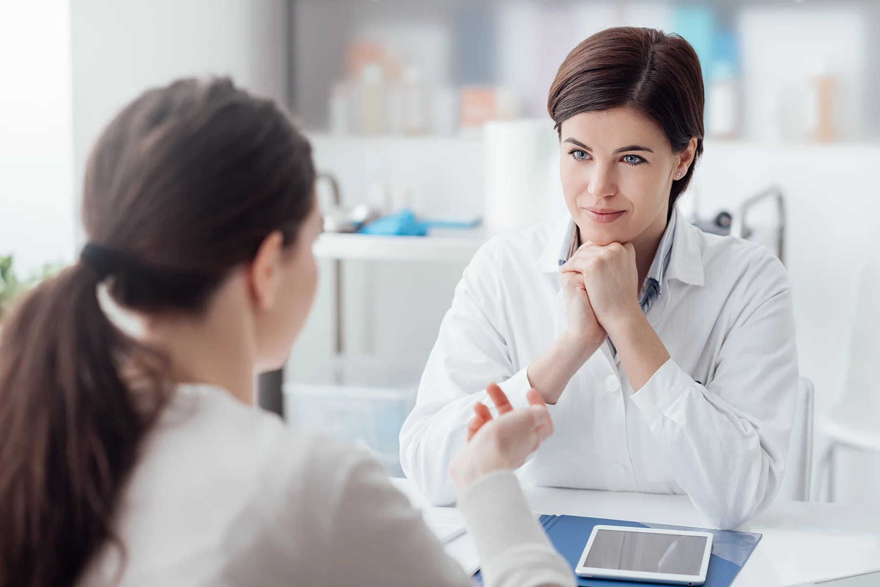 Woman consulting female doctor