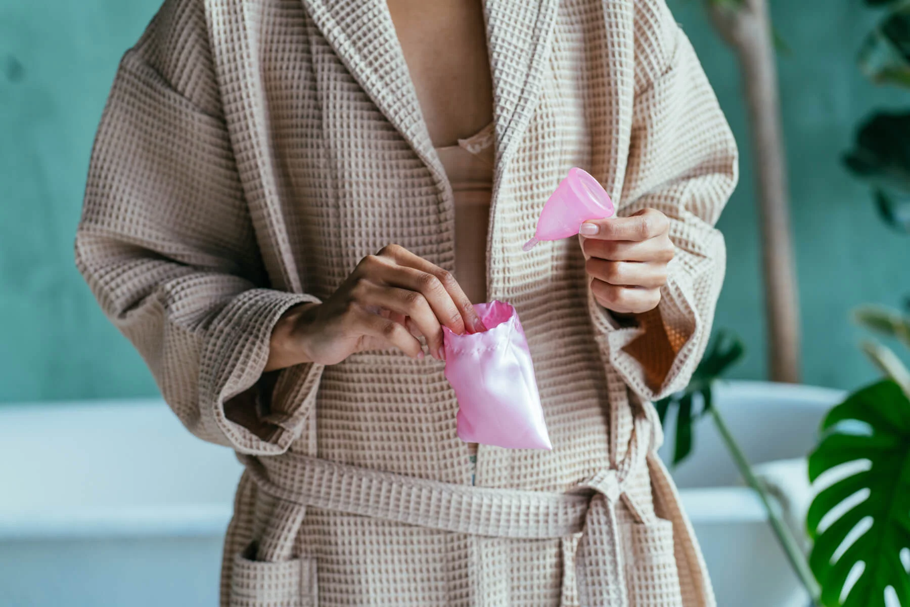 sexual health belgium: a woman holding a menstrual cup