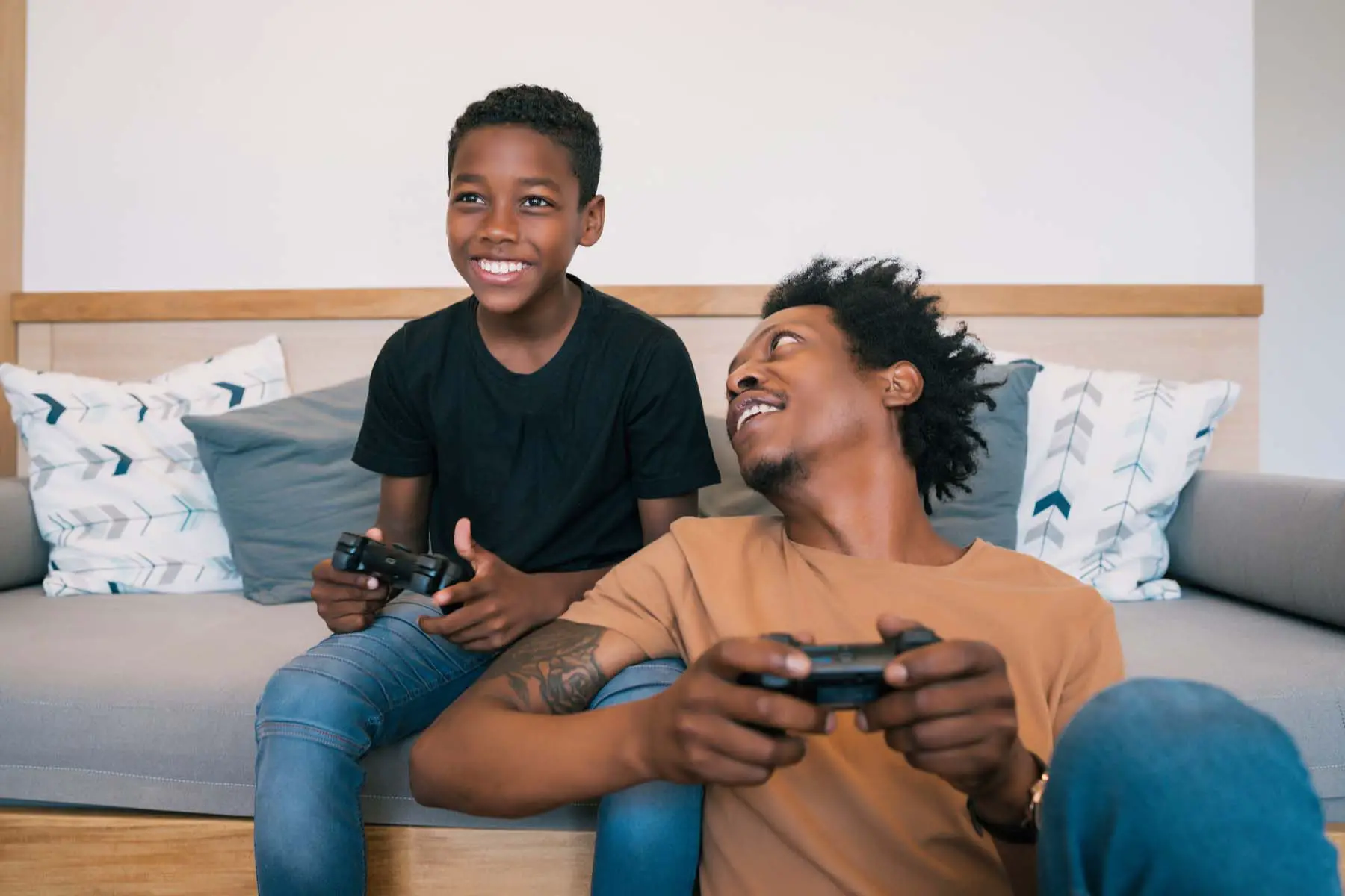 dad son playing video games