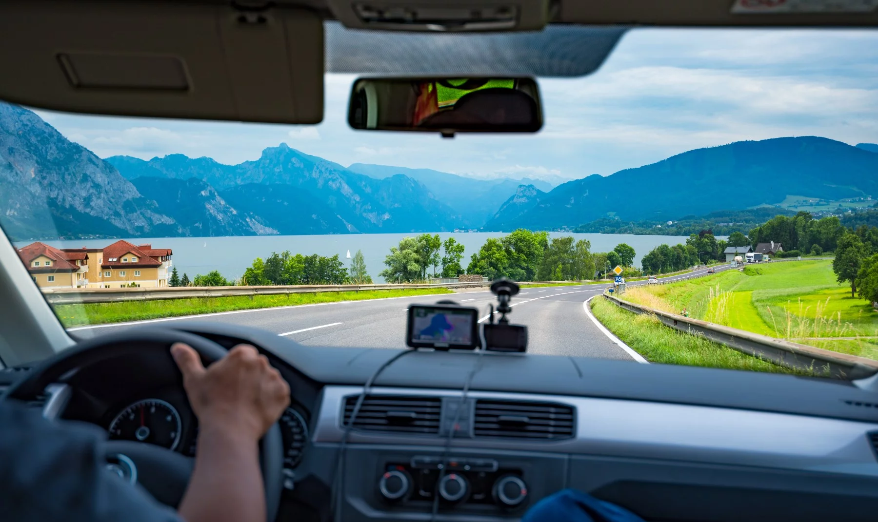driver in car on scenic Switzerland road