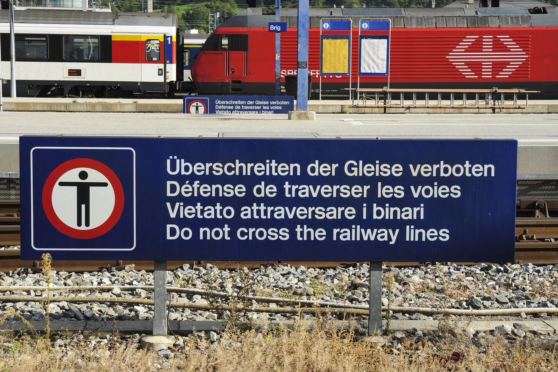 Multilingual sign at a train station in Switzerland