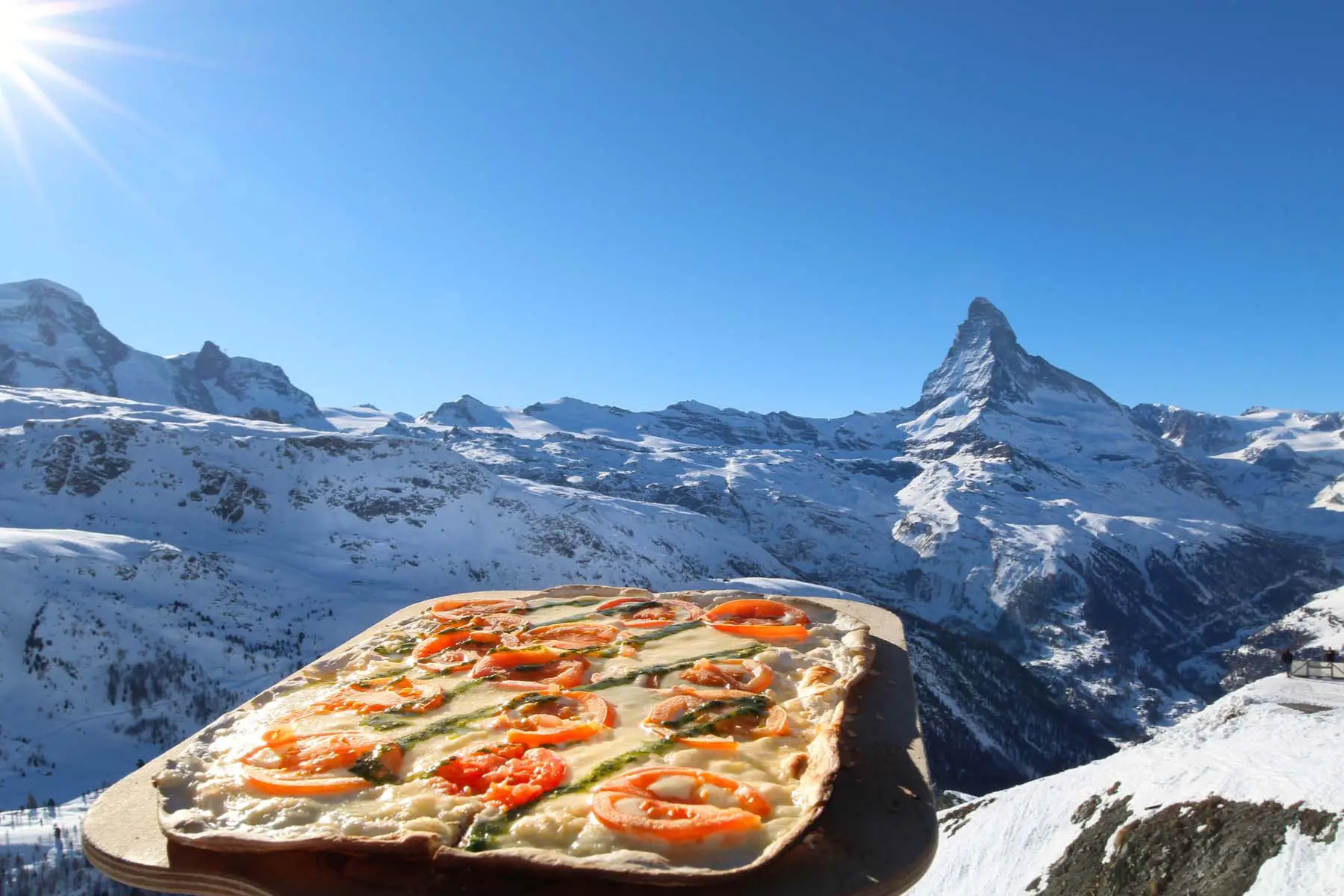 Pizza on a platter in the Swiss mountains
