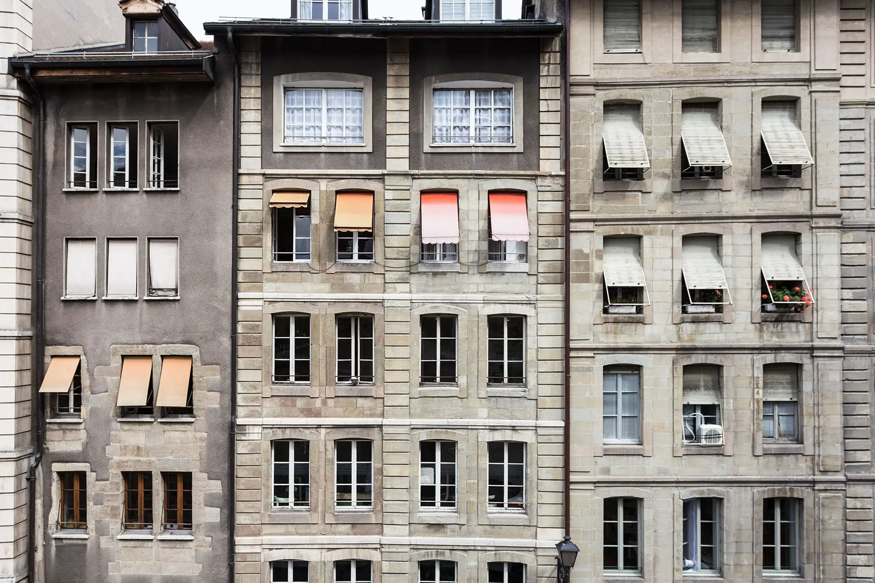 The facade of an old residential building in Geneva, Switzerland.