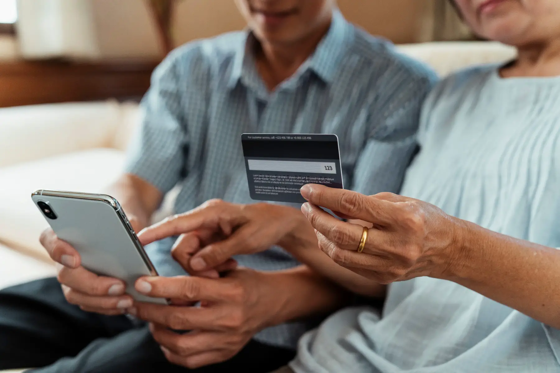 older couple transfer money with a traditional bank online