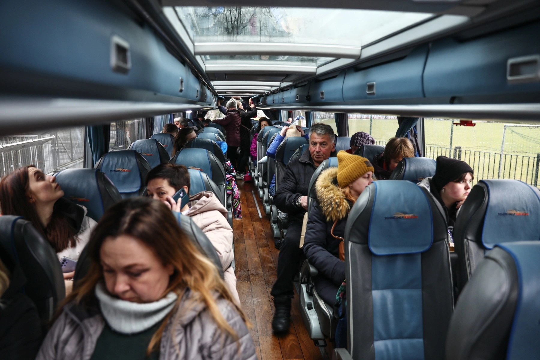 Refugees fleeing Ukraine on bus to Switzerland for humanitarian aid