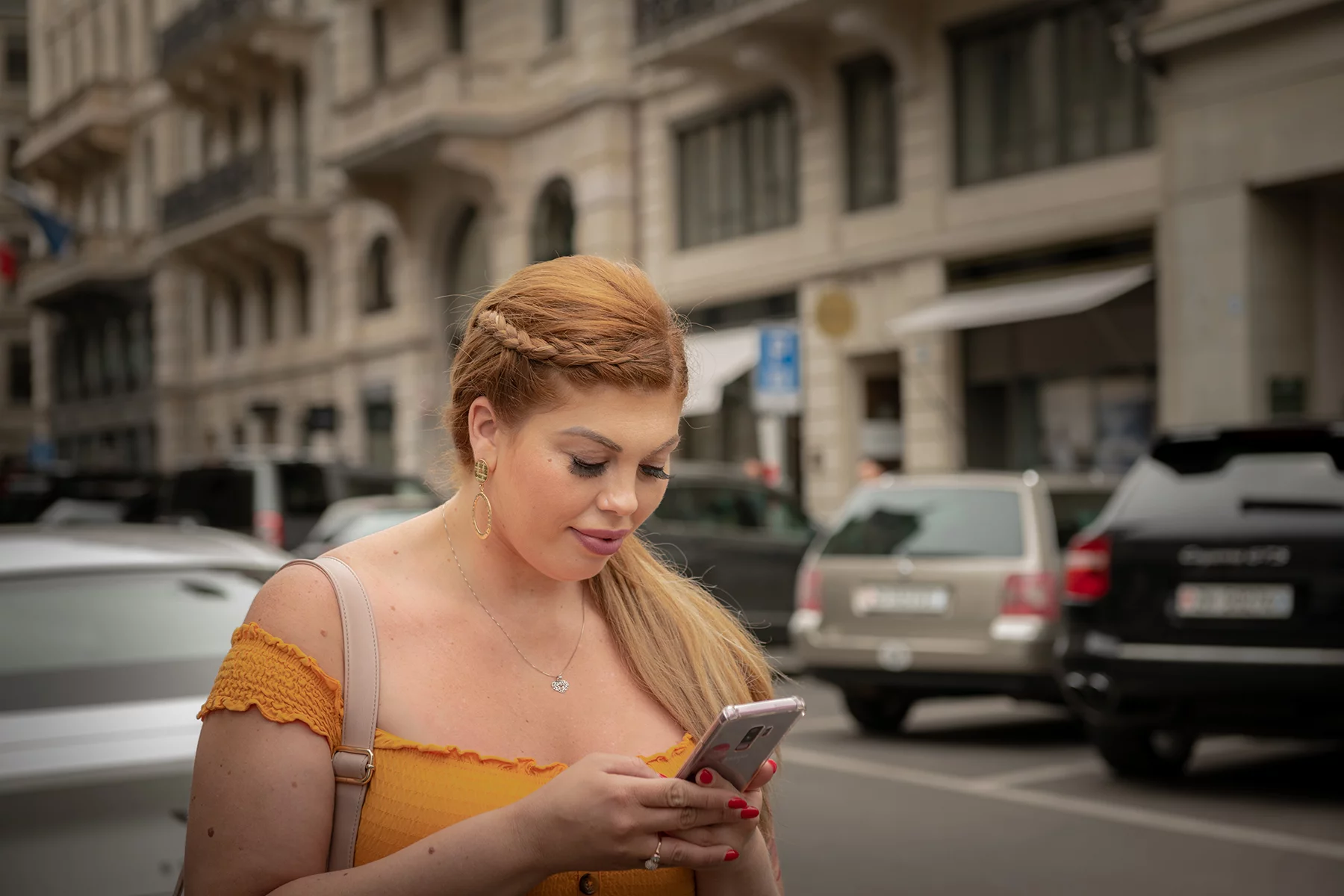 A woman using her smartphone in Zurich, Switzerland
