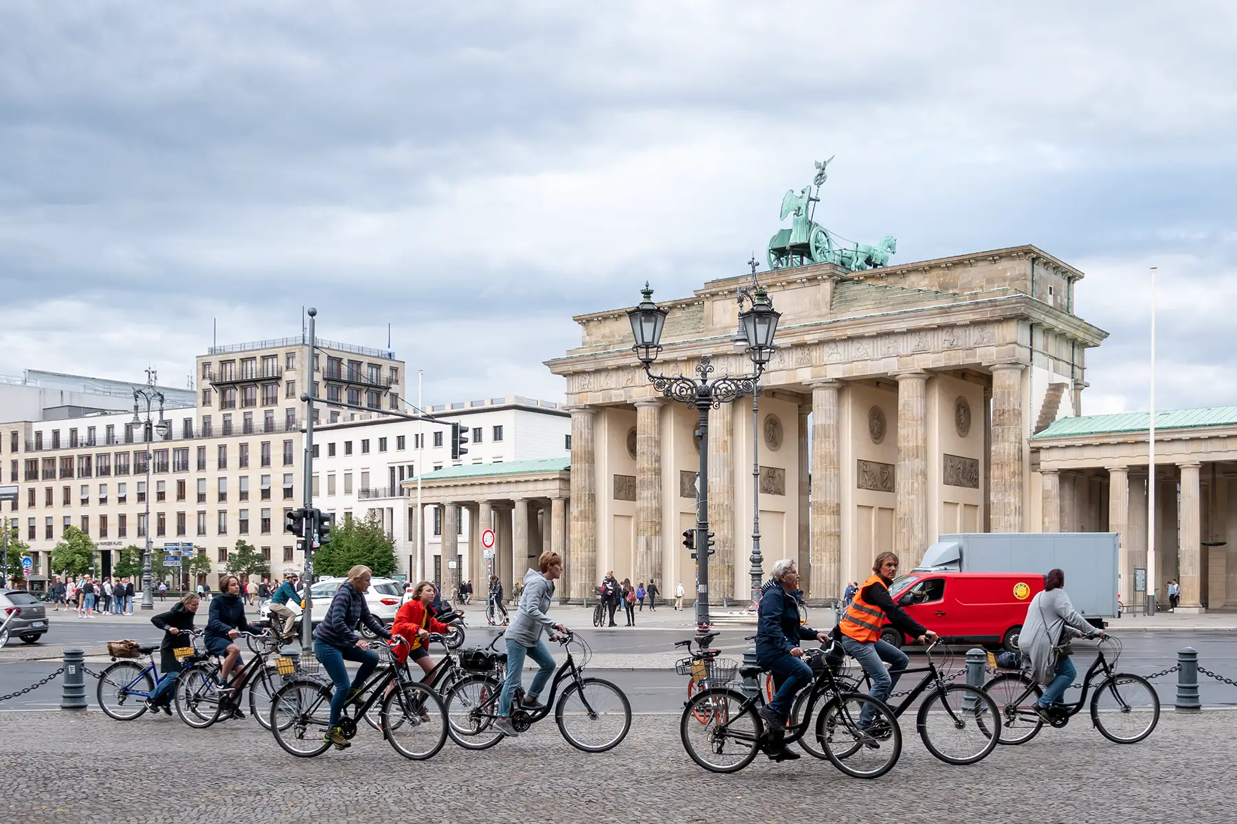 Cyclists in front of Brandenburg Gate in Berlin