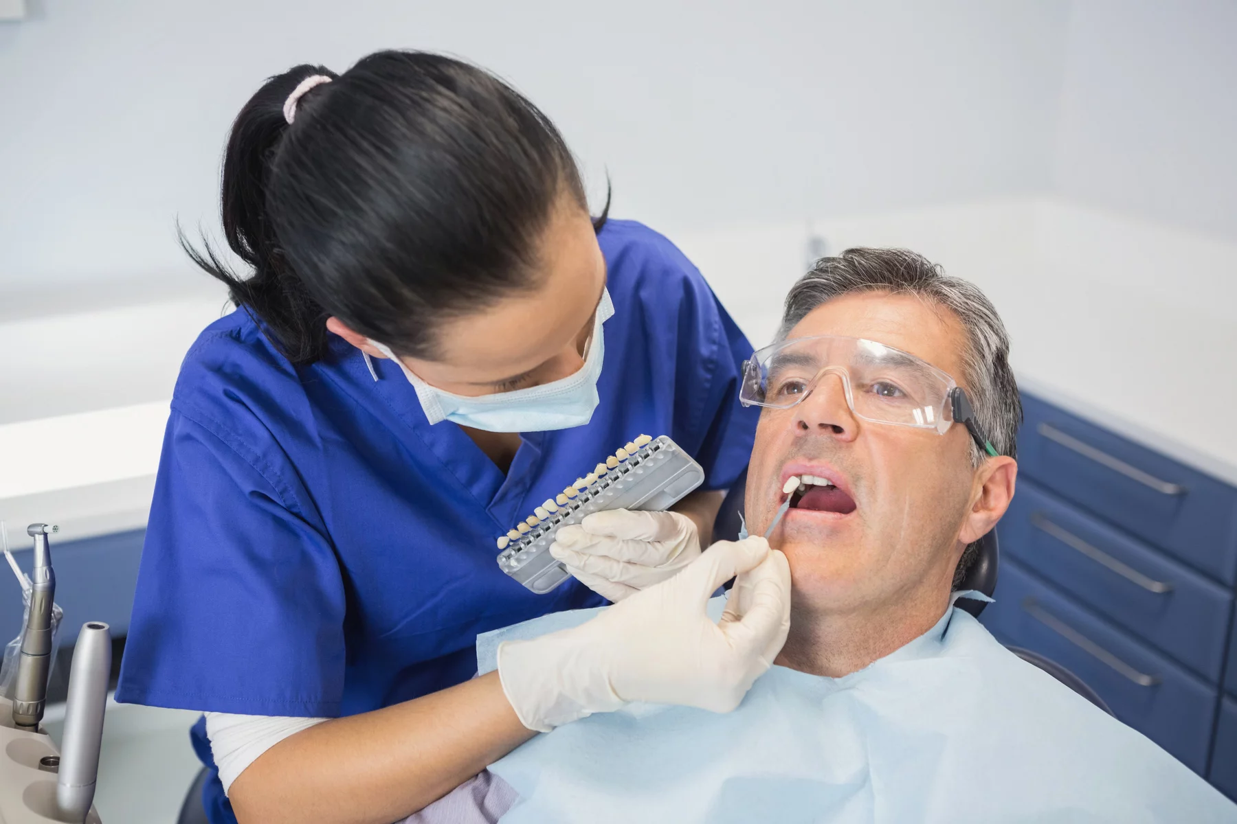 Dentist performing cosmetic dentistry