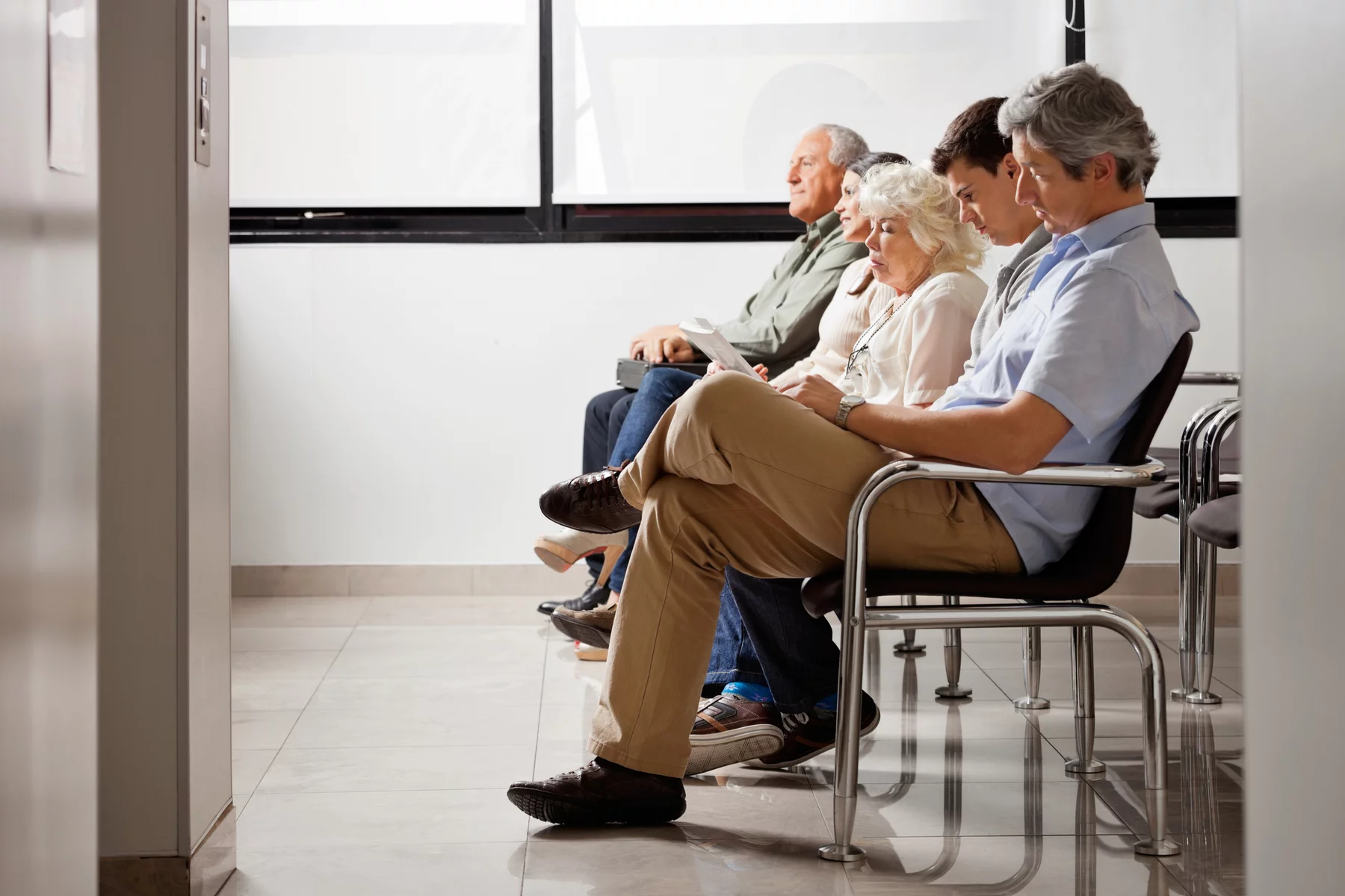 patients waiting in doctor's waiting room