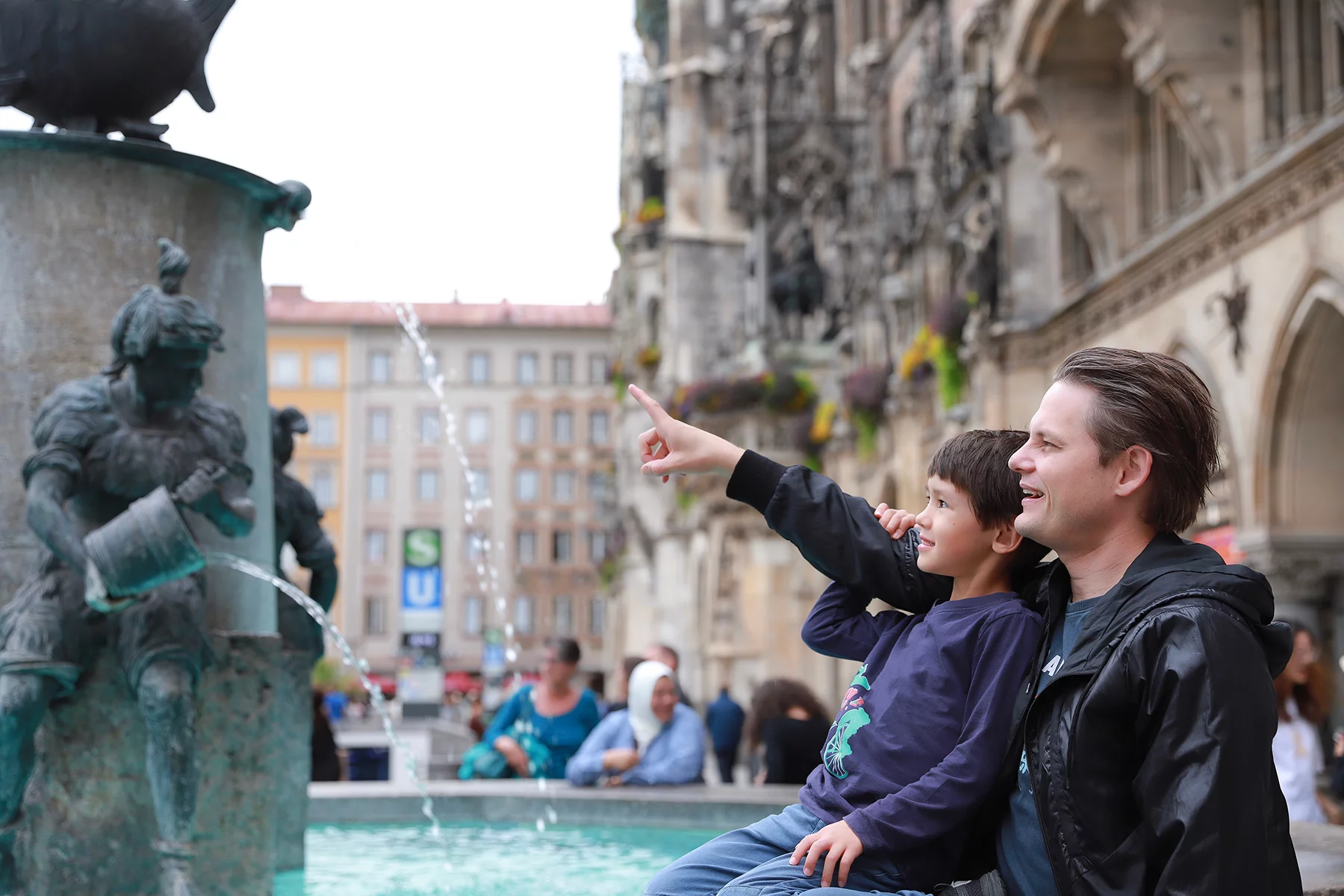 Father and son outside Munich Town Hall