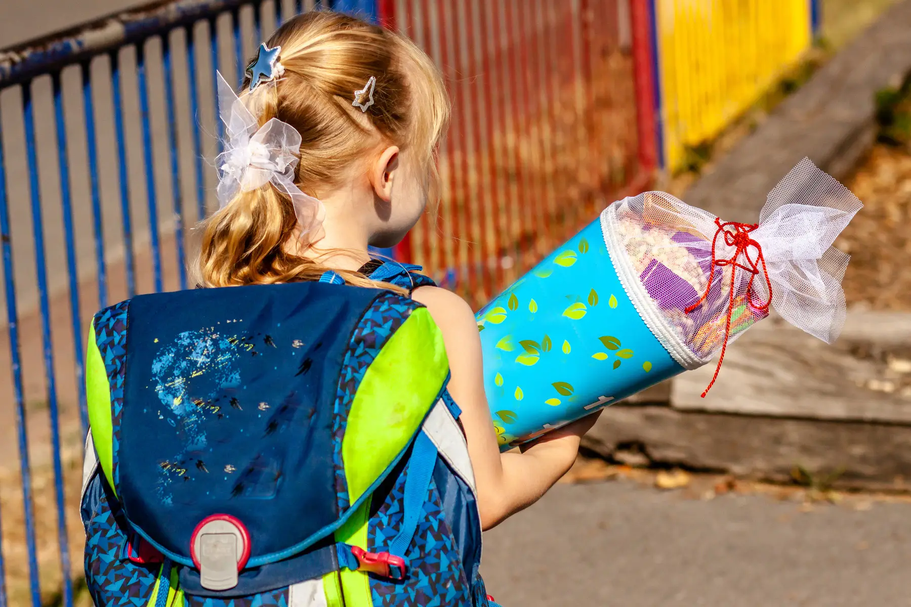 A girl carrying a Schultüte to her primary school in Germany