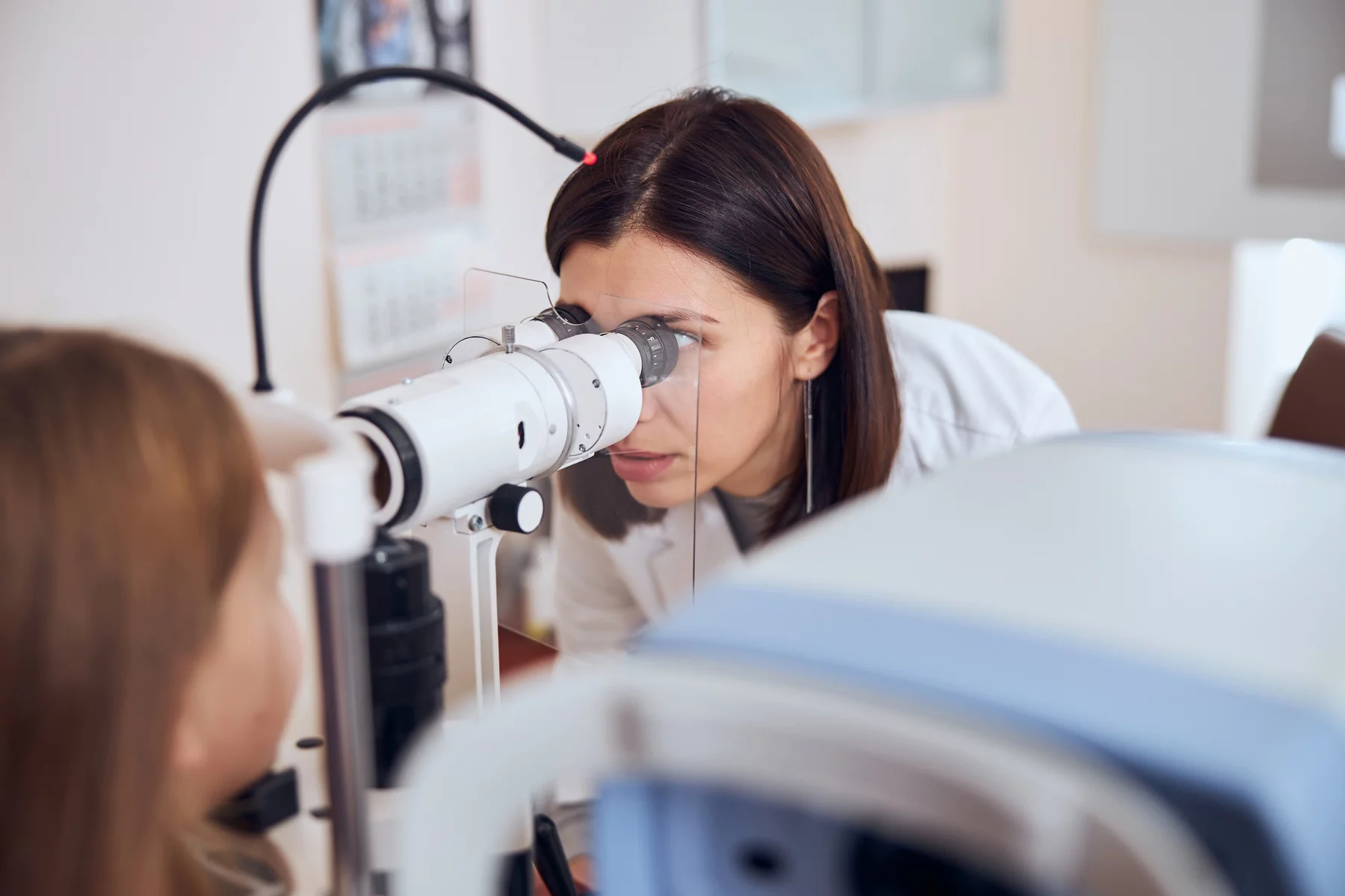 an optometrist performing an eye examination
