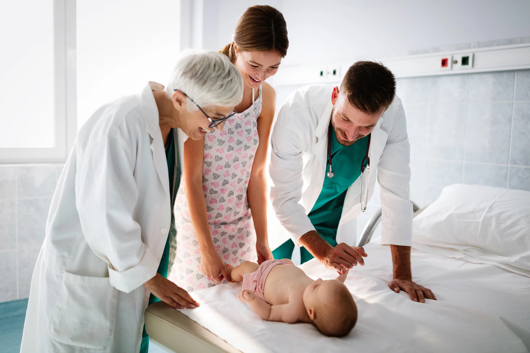 Pediatrician examines a baby