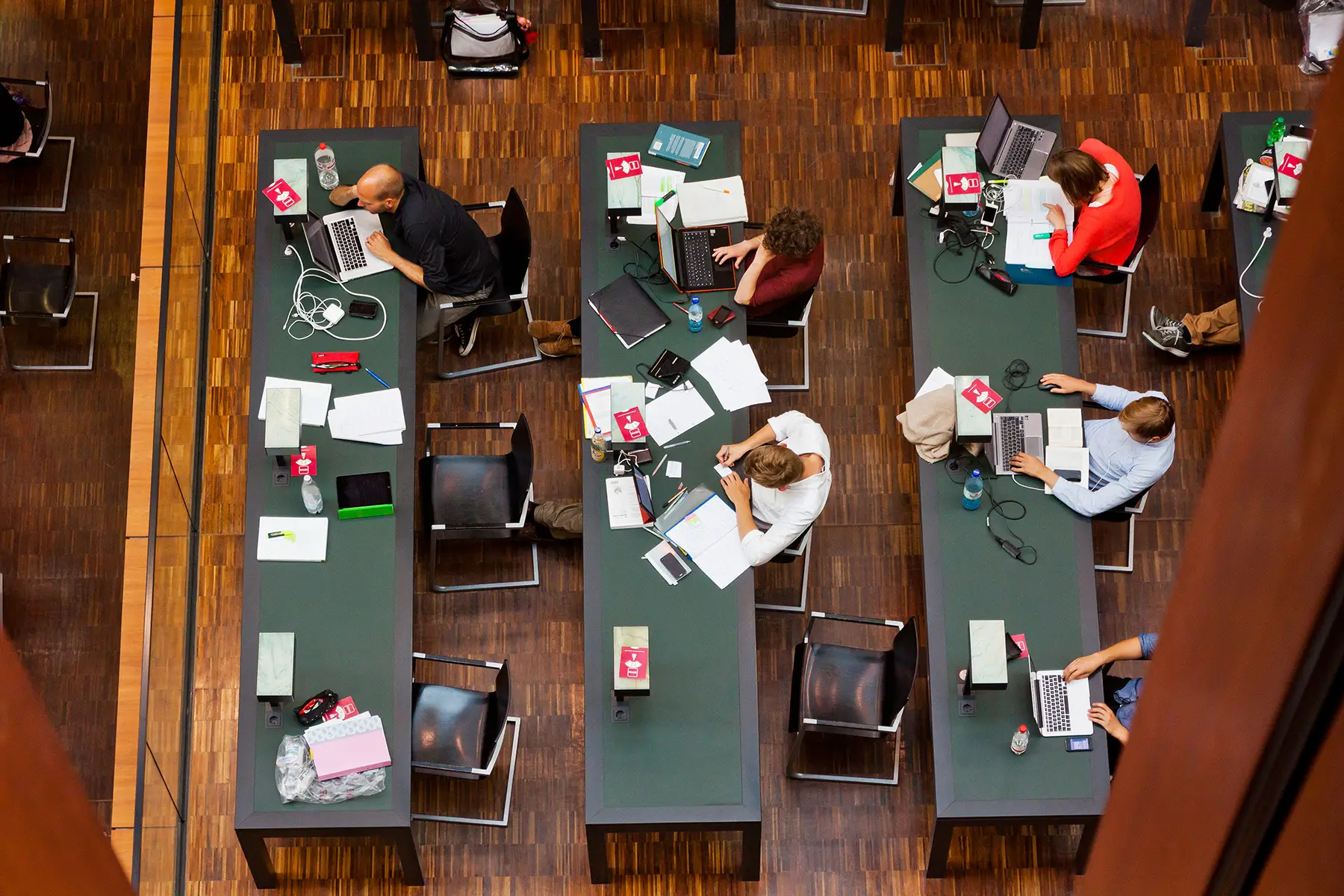 Overhead view of students working in a library