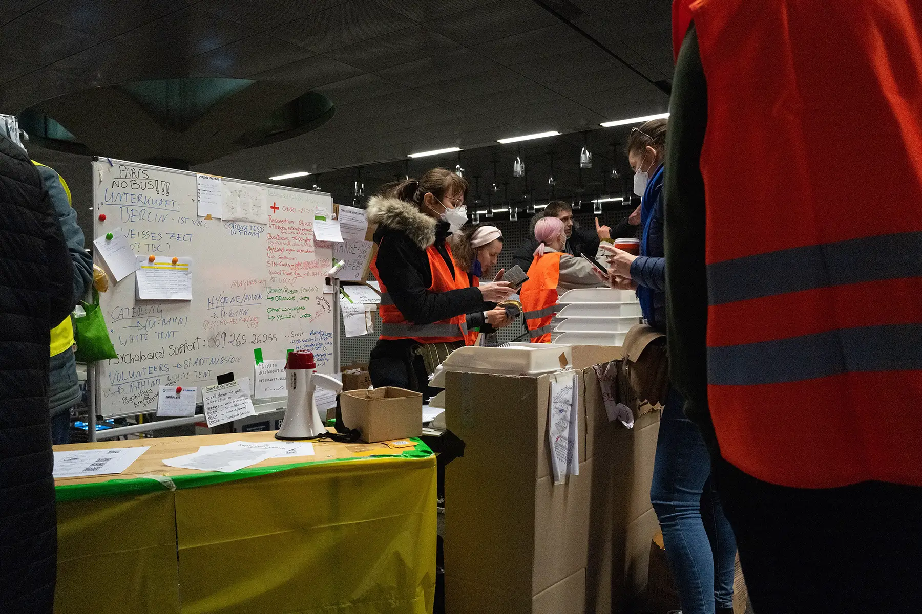 Volunteers helping displaced people at Berlin Station