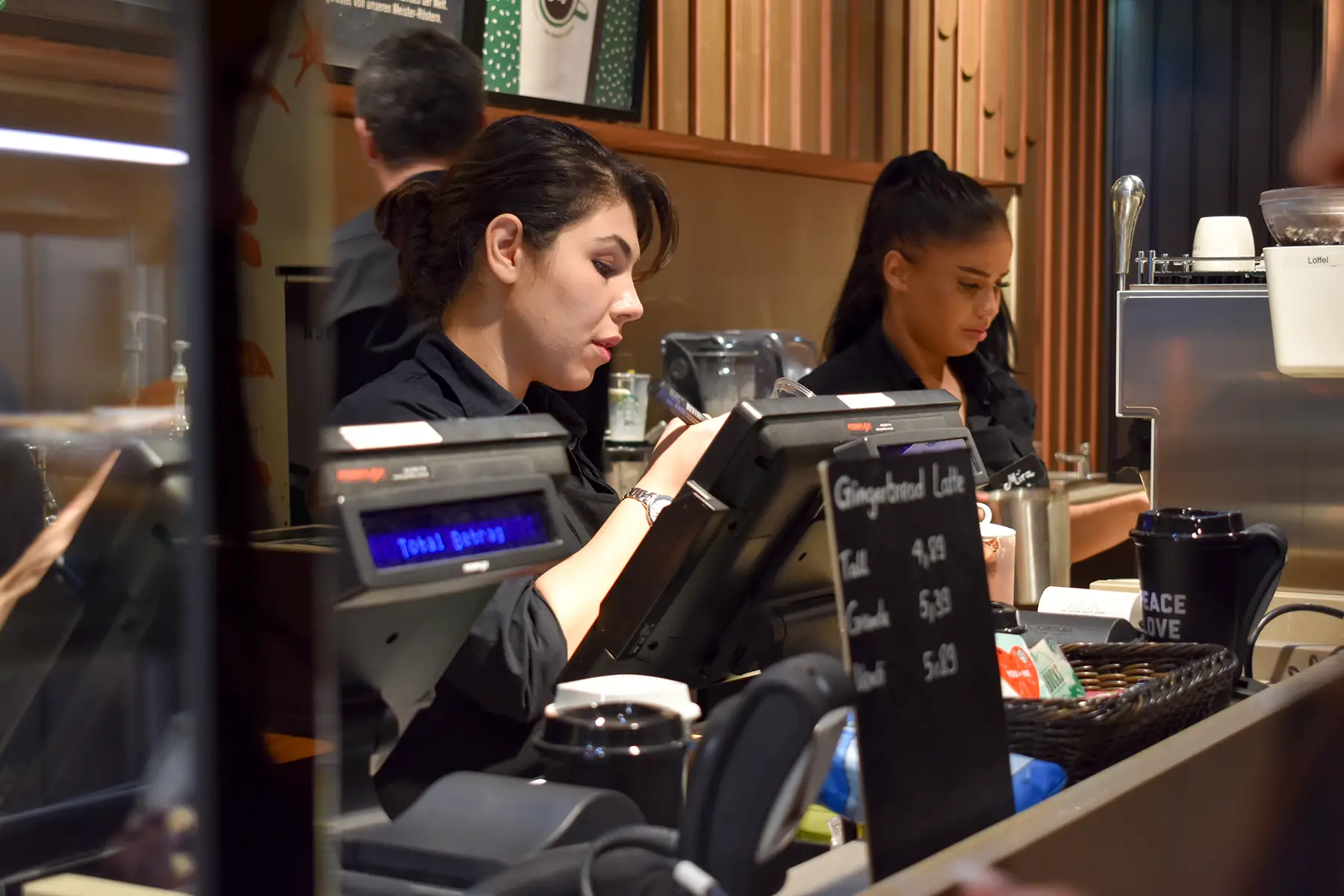 Women working at a cash register in a German café